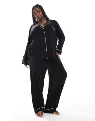 ASOS DESIGN Curve super soft long sleeve shirt & trouser pyjama set with contrast piping in black | ASOS (Global)