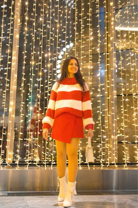 Sweater 
Hand knit sweater 
Striped sweater 
Red skirt 
Winter fashion 

#LTKfindsunder50 #LTKsalealert #LTKSeasonal