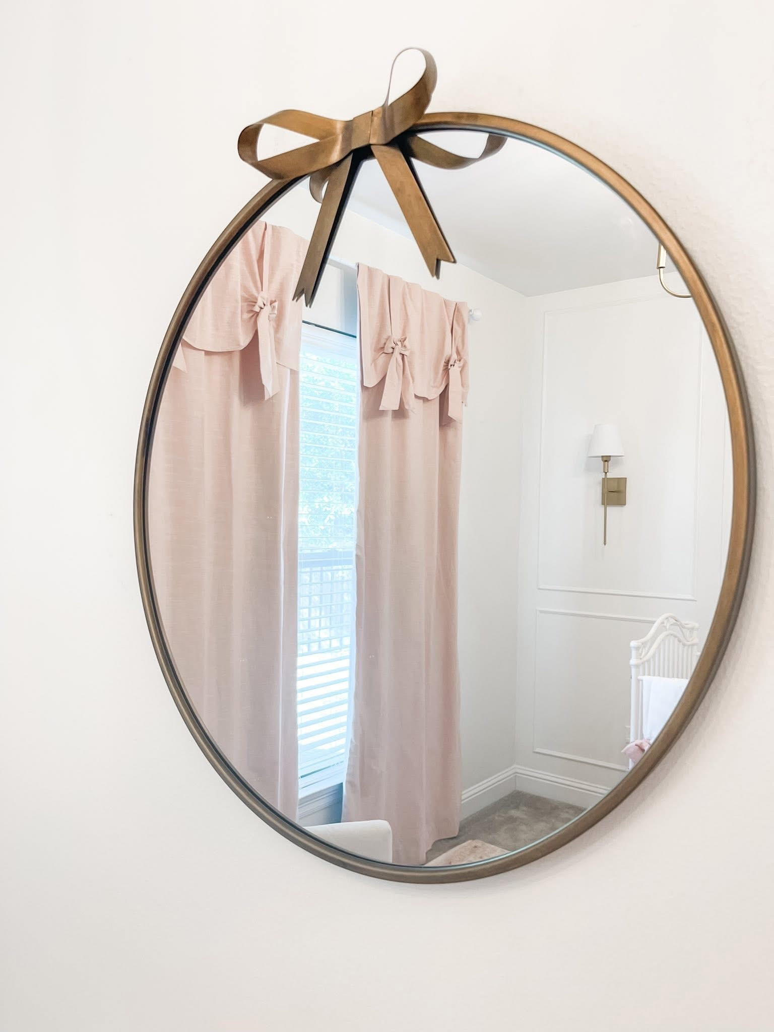 Gold bow wall mirror. Little girls room, nursery 

#LTKKids #LTKHoliday #LTKSaleAlert