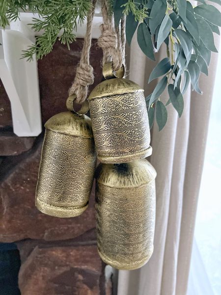 The viral gold Christmas bells are so beautiful and easy to style in any room. These come in a set of 3, and I used a couple cord bundles to attach to the fireplace mantle.

Christmas bells, holidays bells, mantle decor, Christmas decor, holiday decor, holiday styling, holiday stems, Christmas style, home decor, Amazon home, Amazon finds, Christmas finds

#LTKhome #LTKHoliday #LTKSeasonal