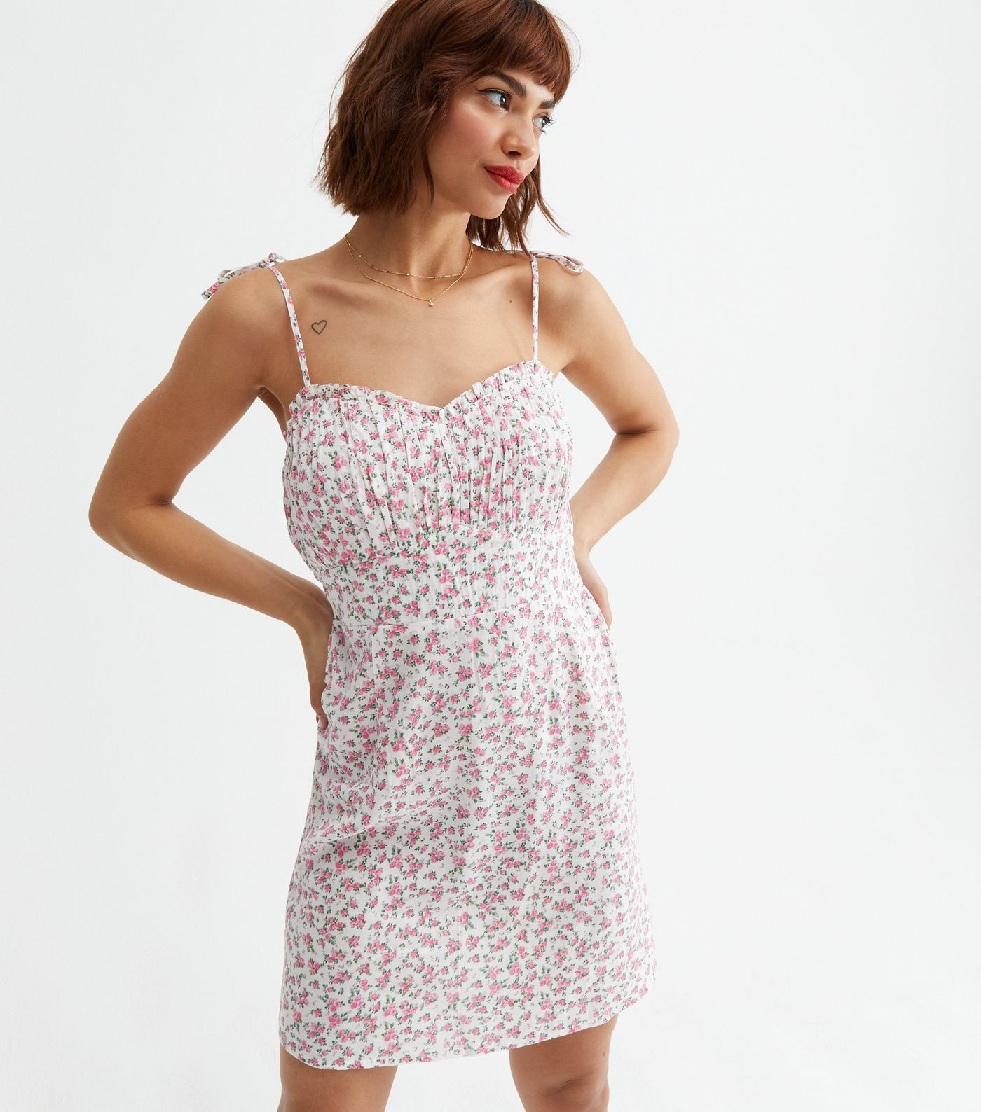 Pink Ditsy Floral Ruched Bustier Strappy Mini Dress
						
						Add to Saved Items
						Remove ... | New Look (UK)