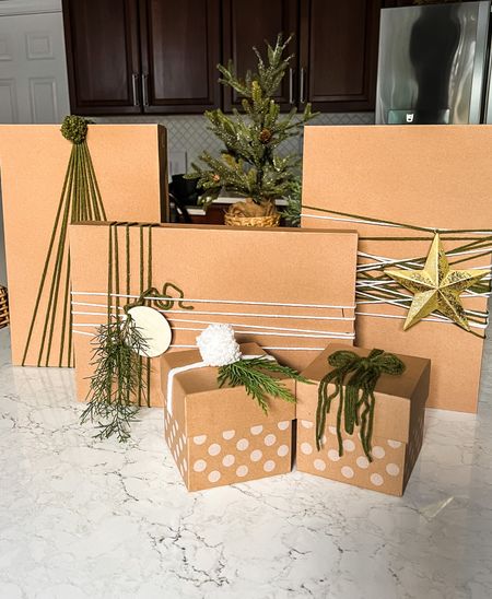 Easy and inexpensive gift wrapping ideas. Use yarn instead of ribbon. Add an ornament as the tag for a meaningful tag that will be saved. Or make your own gift tags that you can reuse year after year. Kraft paper with small gold foil dots are a pretty neutral backdrop. Or try using Kraft paper boxes and skip the wrapping paper altogether! #giftwrapping #christmasgifts #budgetgiftwrap

#LTKSeasonal #LTKhome #LTKHoliday