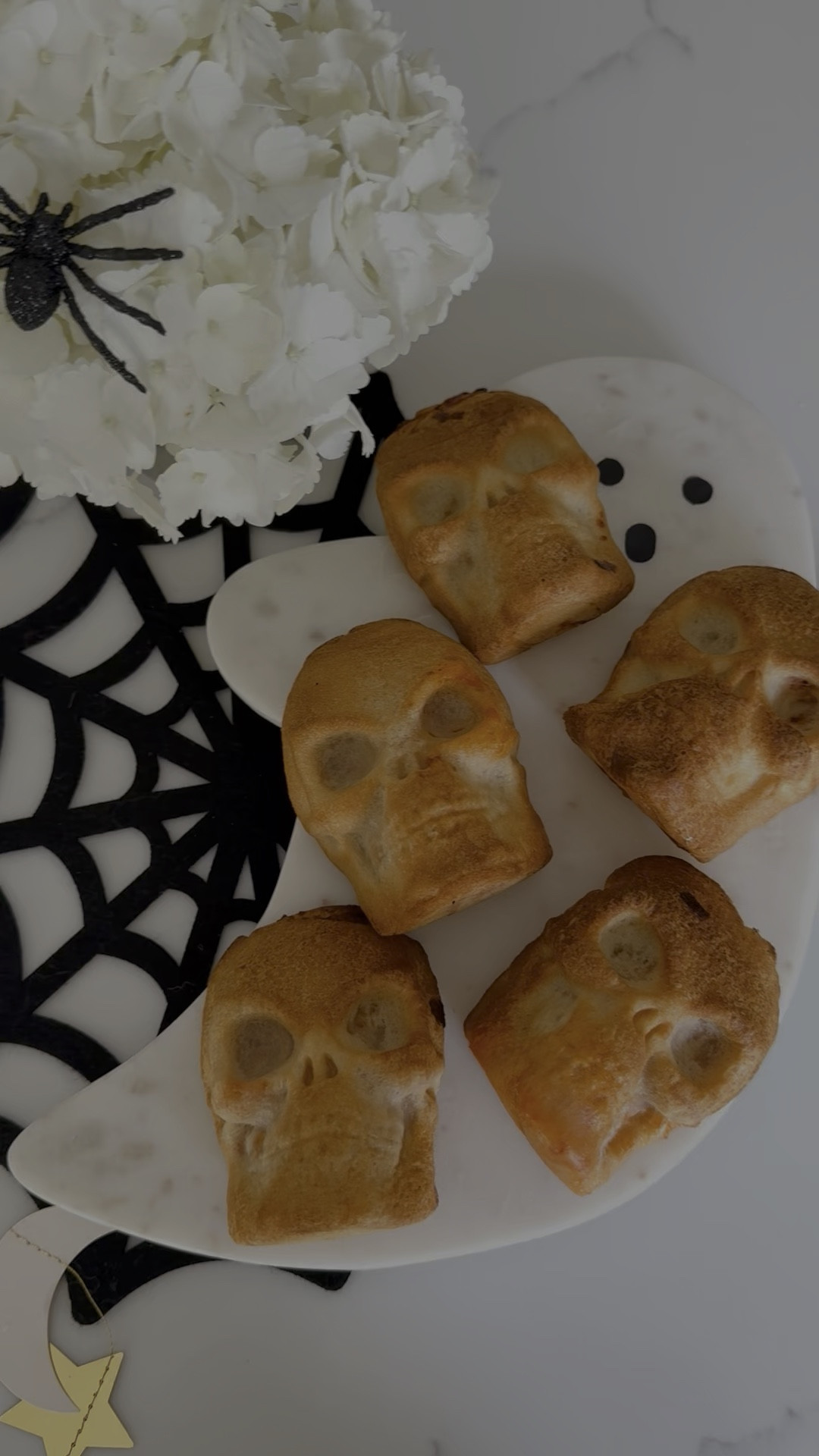Skully Pizza Pockets!
.

1 ½ tablespoons melted butter, to grease the pan
3 rolls Pillsbury Pizza Dough 
9 tablespoons pizza sauce
¾ cup pizza toppings (mini pepperoni, sausage, ham, pineapple, mushrooms, and or veggies)
2 cups shredded mozzarella cheese
egg wash 1 egg mixed with 1 teaspoon water
Instructions:

Drape the pizza dough into a skull cavity in your skull pan.
Fill with 2 tablespoons of sauce, 2 tablespoons of pizza toppings, and ⅓ cup of shredded mozzarella cheese.
Cut off the excess dough, and pinch together the seams.
Brush egg wash over the top of the dough.

Preheat your oven to 375 degrees Fahrenheit.
Bake for 18-20 minutes if using the Wilton pan or 28-30 minutes if using the pan linked below until the crust looks cooked through and golden brown.
Remove skulls from pan and serve.




#LTKVideo #LTKHome #LTKSeasonal
