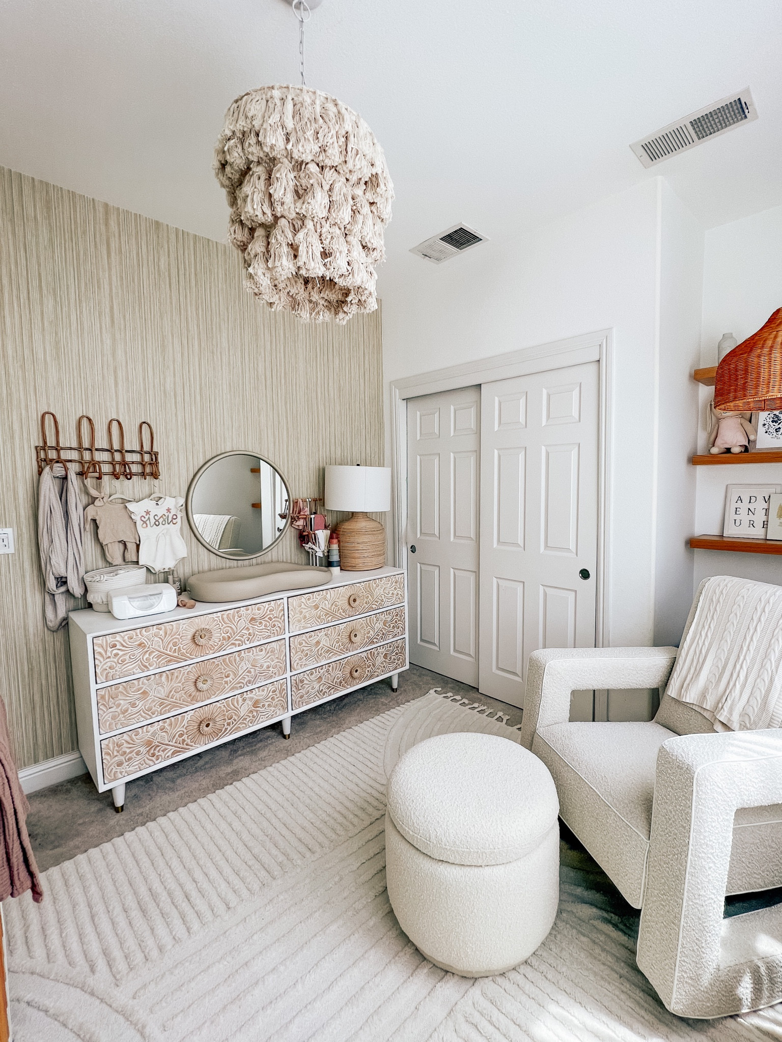 Neutral white nursery boucle rocking chair Anthropologie dresser