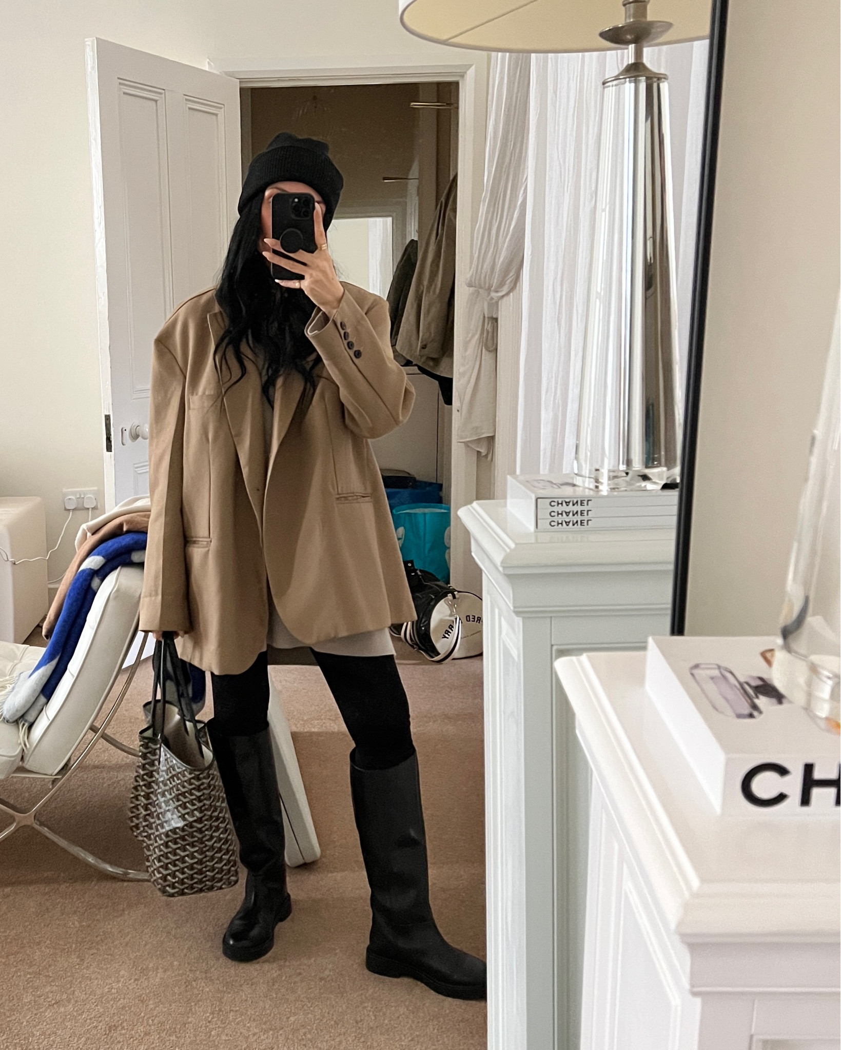 Donna Bartoli of donnabartoli.com wears a simple but chic winter outfit. Oversize boyfriend blazer, black leggings, black cashmere beanie, knee high riding boots, cashmere knit jumper. Exact items listed apart from blazer but similar options given 

#LTKSeasonal #LTKeurope #LTKfit