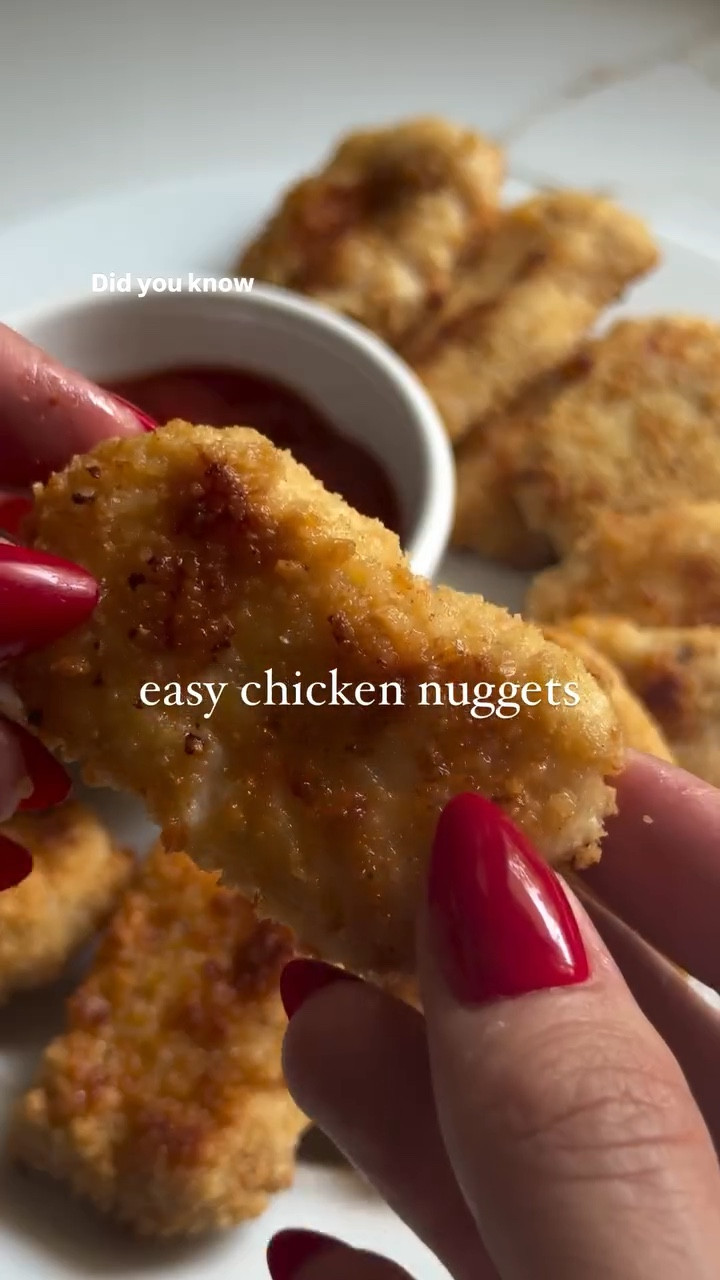 I feel like this is a parent hack and I’m not sure why haven’t made these before. My kids could easily eat chicken nuggets everyday of the week if I let them so why not make them at home easily made with simple clean ingredients? These are so great for meal prep and SO crispy and delicious 🤤 

1 lbs ground chicken
5 tbsp milk  1/4 cup panko breadcrumbs
1 tsp garlic seasoning
1 tsp salt
1/2 tsp black pepper
Optional: 1 or 2 tbsp of honey (makes them a bit sweeter which kids loves) 🍯 
1 egg
3 Tablespoons melted butter

Breading:
1 cup panko bread crumbs
1/4 cup grated parmesan cheese

1. add milk and breadcrumbs to a bowl, let sit for a minute before adding seasoning. 

2. In a different bowl, add ground chicken and add milk mix. Mix everything using your hands. Scoop out about 1 tbsp and shape into nuggets.

3. In a bowl, whisk one egg. On a plate, mix 1 cup of breadcrumbs and cheese.

4. Brush each nugget with the whisked egg and then coat with breading mix.

5. Melt 1.5 tbsp of butter and brush each top side of nugget with the butter.

6. Bake in oven at 375F for 8 minutes. Remove from oven and brush with remaining 1.5 tbsp of butter, both sides of the nuggets.

7. Bake for another 7 minutes. Broil on high for 1 minute.