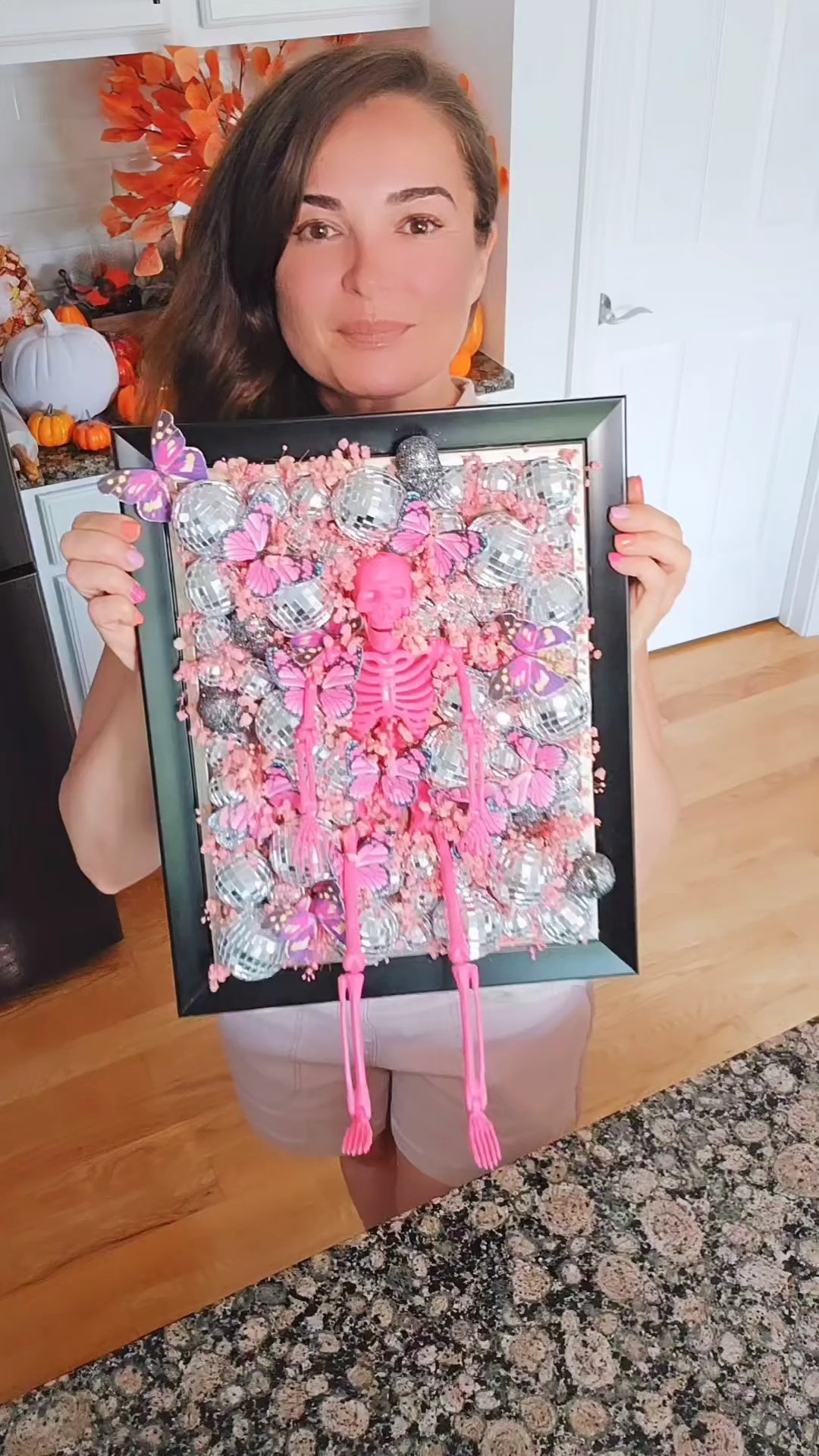 DIY Halloween Disco Wall Art 🪩💀🦋🌸 All you need is a hot glue gun, picture frame, plastic skeleton, decorative disco balls, paper butterflies, and dry flowers!

#LTKHome #LTKParties #LTKSeasonal
