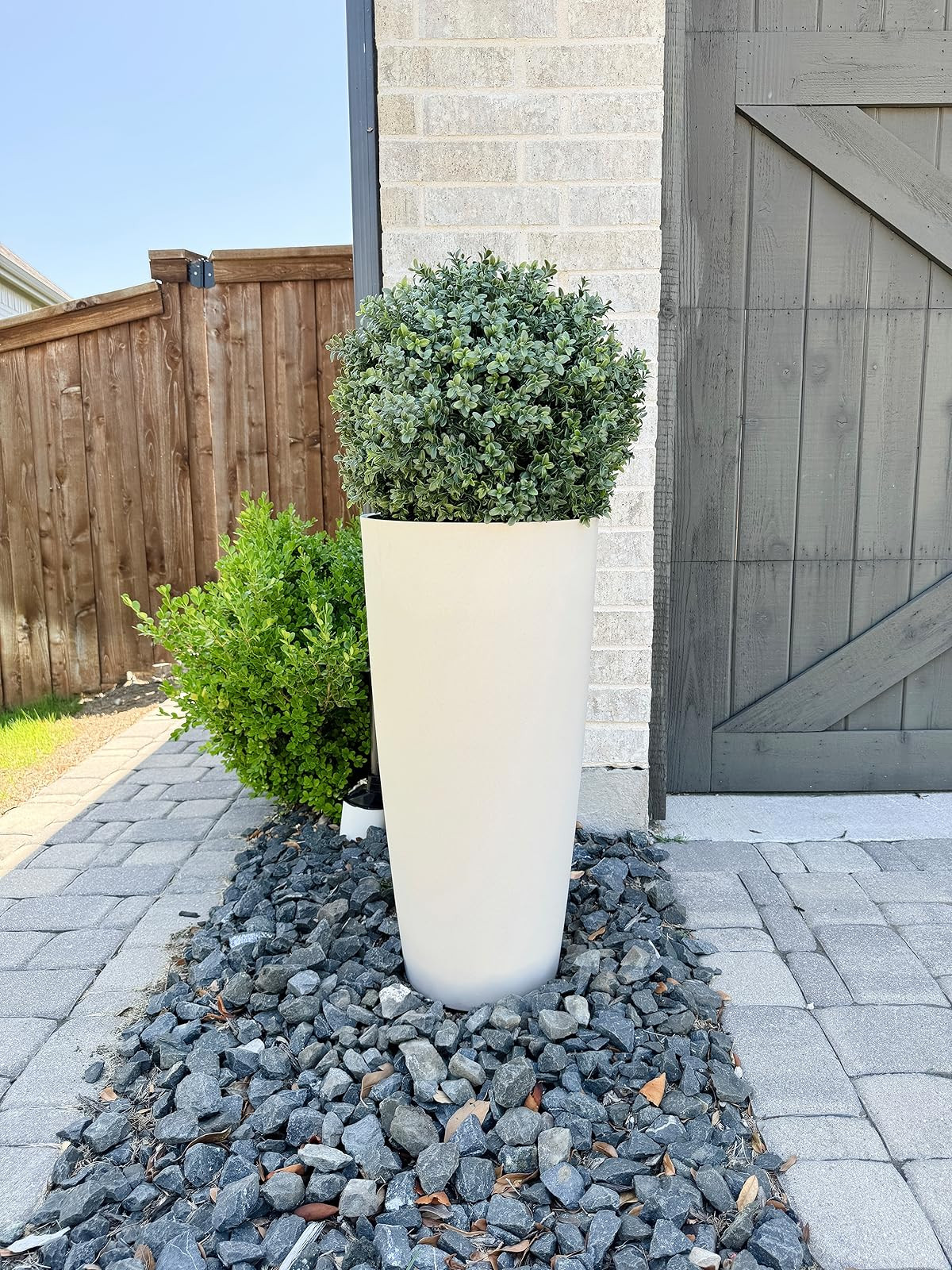We’ve had 2 of this exact setup outside since last spring and they still look amazing! ✨ 

Amazon outdoor planter, faux boxwood topiary, front porch planters, faux greenery outdoor, artificial boxwood plant, porch decor planters, large outdoor planters, weather resistant planters #frontporchdecor #outdoorplanters #fauxgreenery  

#LTKSeasonal #LTKHome #LTKdayinmylife