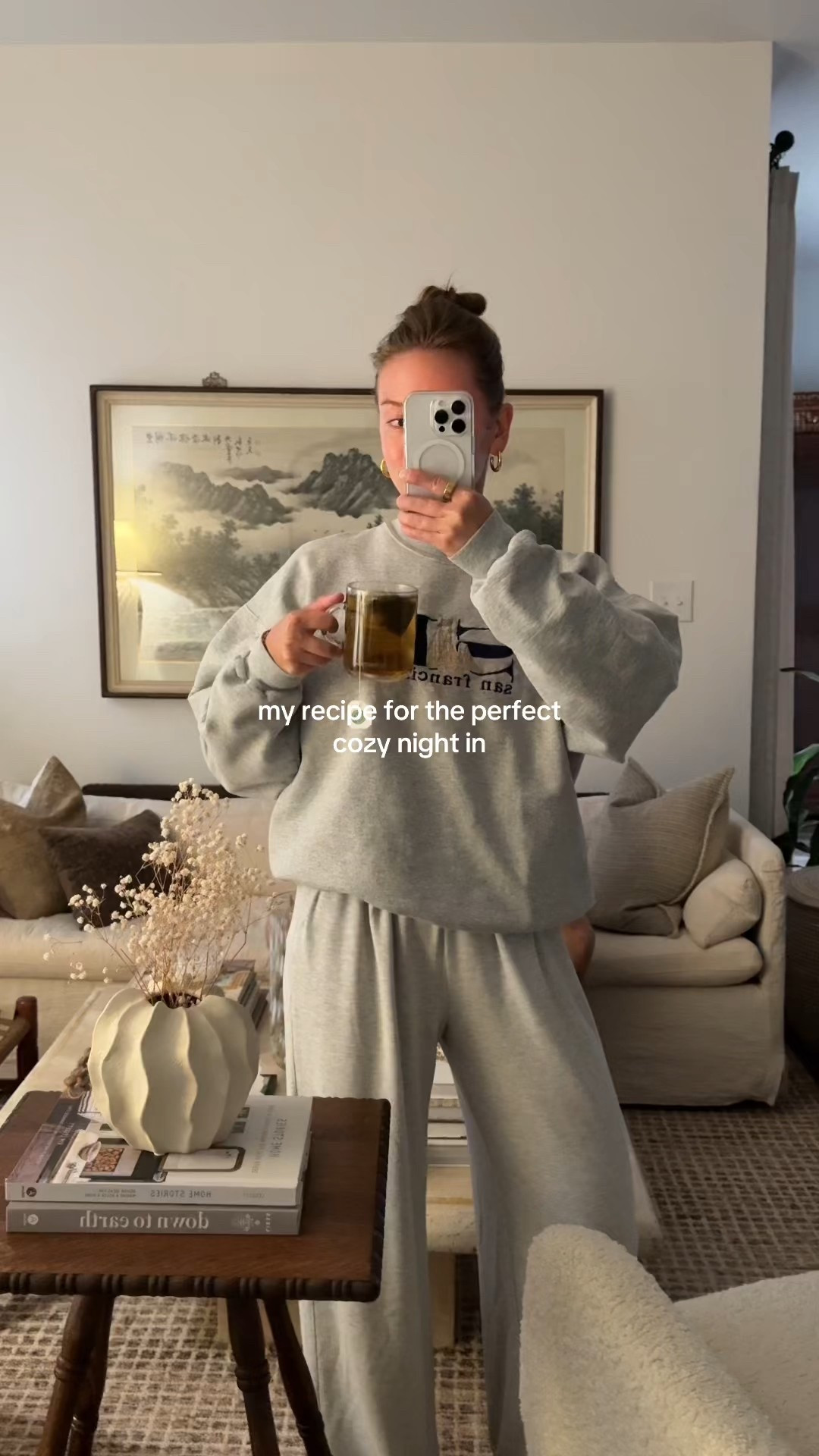 8/14/25 Cozy summer storm night in 🌧🍑 Wearing my Abercrombie loungewear pants with my Parke x SET collab sweatshirt, curled up in the living room with all the cozy vibes for peach crisp + a new episode of The Summer I Turn Pretty. Linking my outfit and our living room furniture here 🤍

