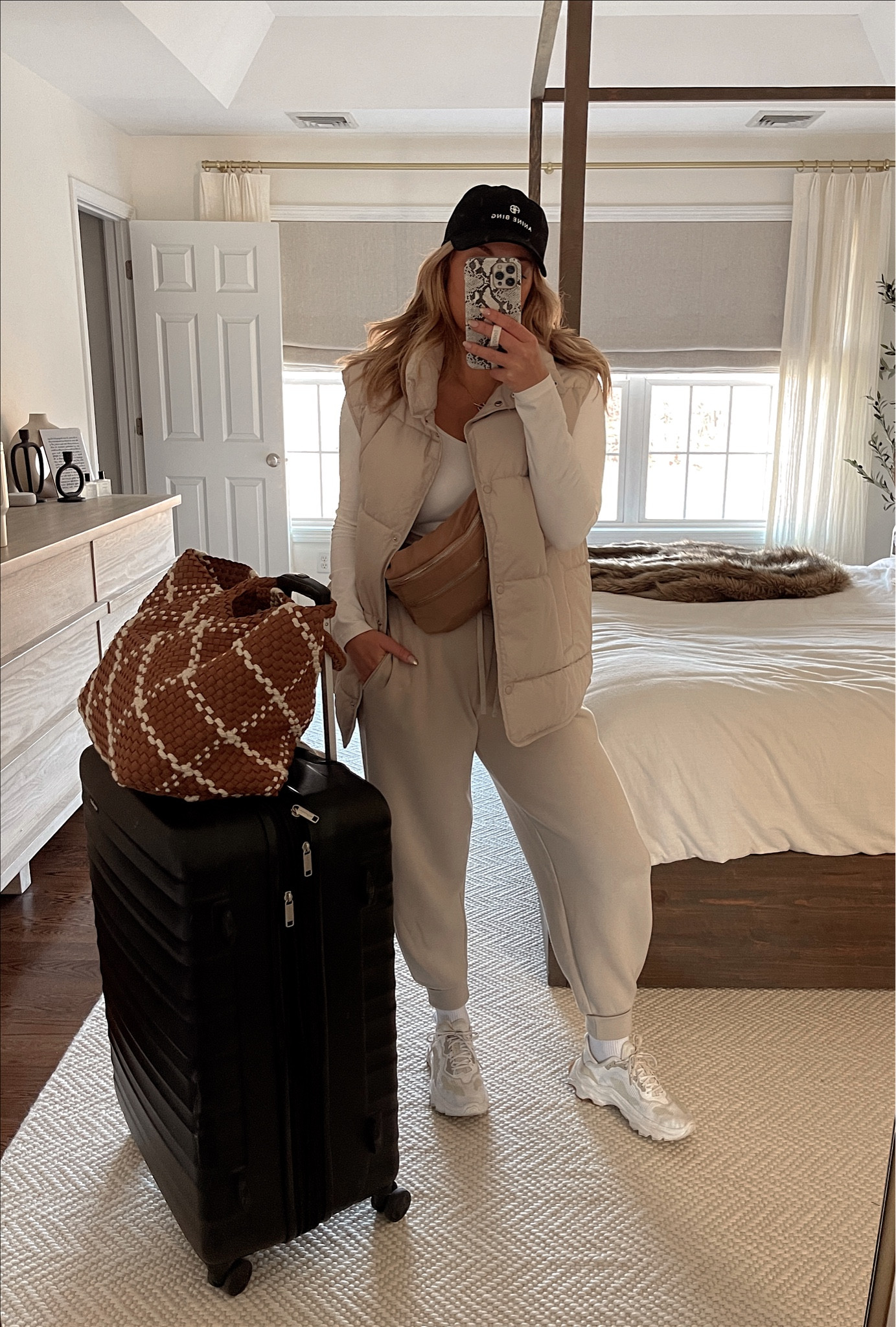 Travel look wearing align too with puffer vest and Varley sweats 