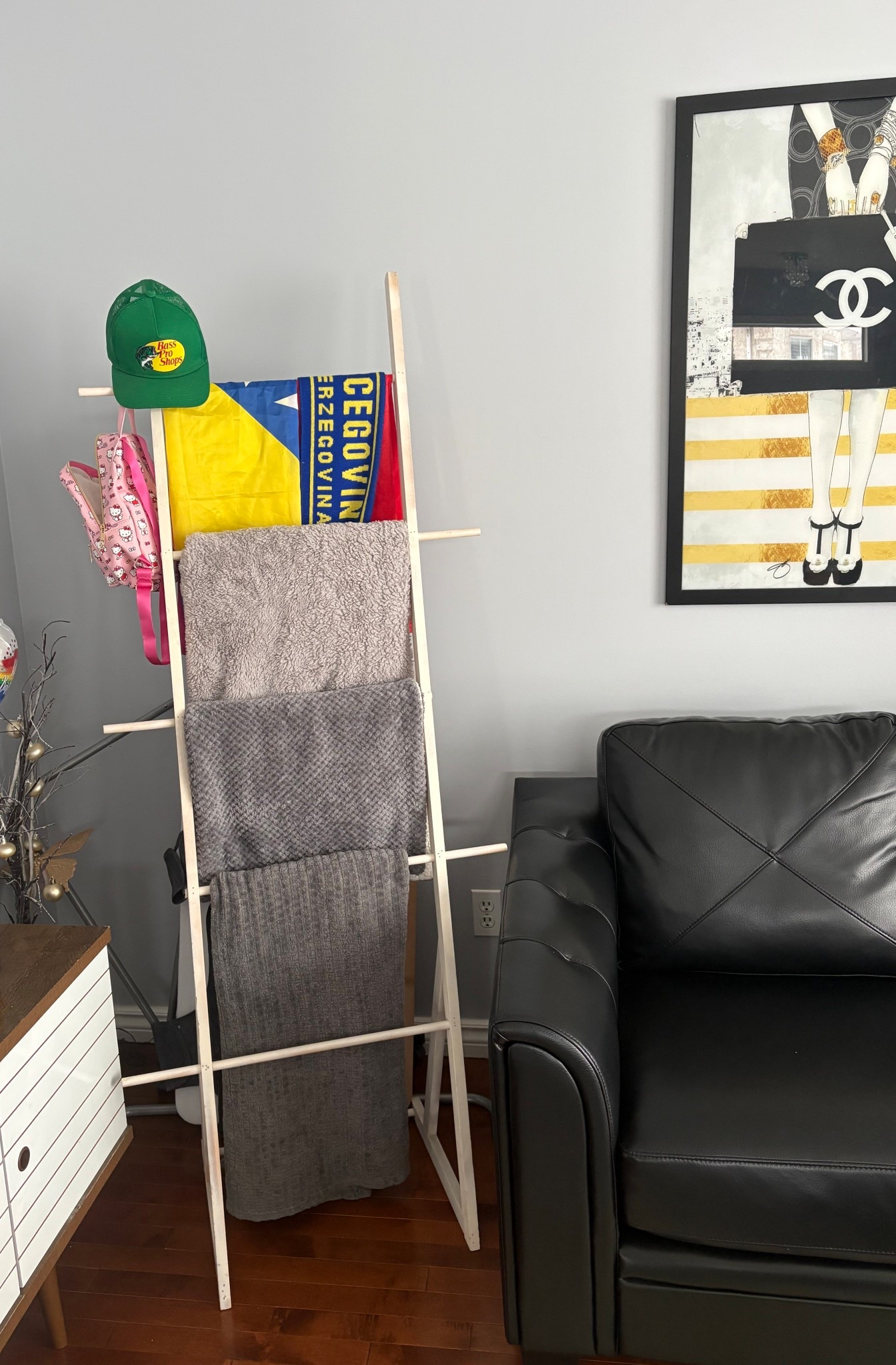 Easy way to maximally space - a blanket ladder.

The corner between the TV and the couch can be a wasted space but this ladder is cute and we can actually use it for blankets to maximize space #LTKHome