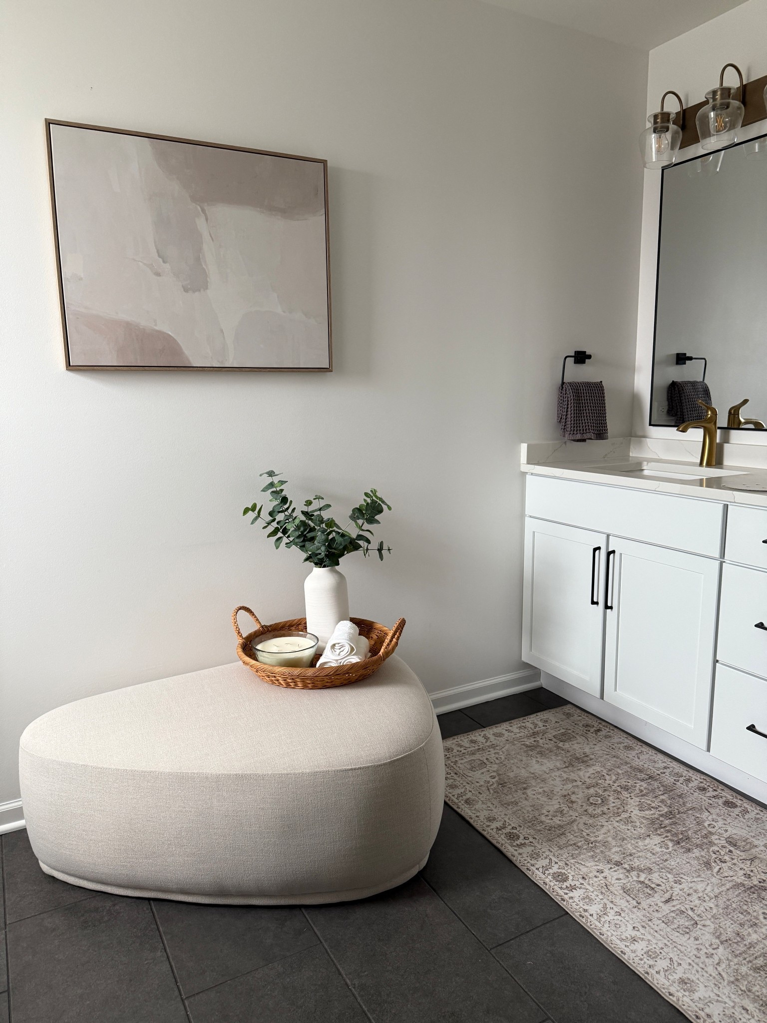 Bathroom decor! We had this large open wall in our bathroom and the ottoman and canvas worked perfectly 😍