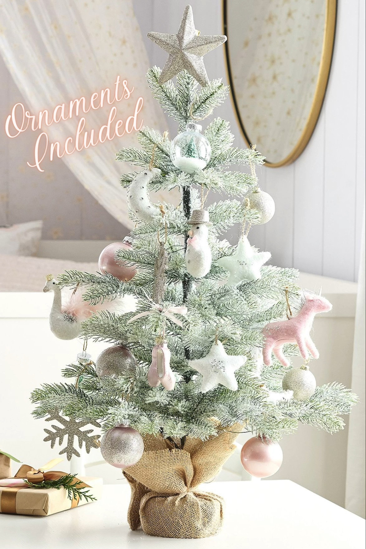 This adorable mini tree is a dream Christmas tree for little ones. This whimsical tree includes 19 pink and white themed ornaments, 45 LED warm lights and topped with a glittering star tree topper. The joy and magic of the season will come to life as the kiddos decorate this tree and when they switch it on the sparkle and glow from the ornaments and lights will enhance the holiday cheer. The burlap covered base will hold the tree securely in place and it includes a timer (6 hours on/18 hours off).

#LTKkids #LTKhome #LTKHoliday
