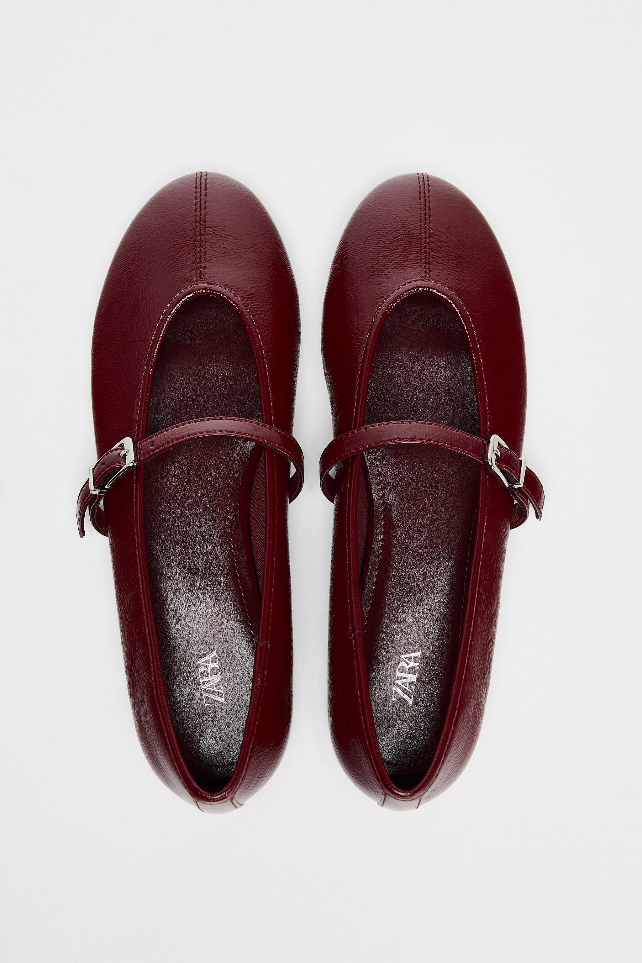 Patent effect ballet pumps. Adjustable buckle strap on the front. Topstitching detail on the uppe... | Zara UK