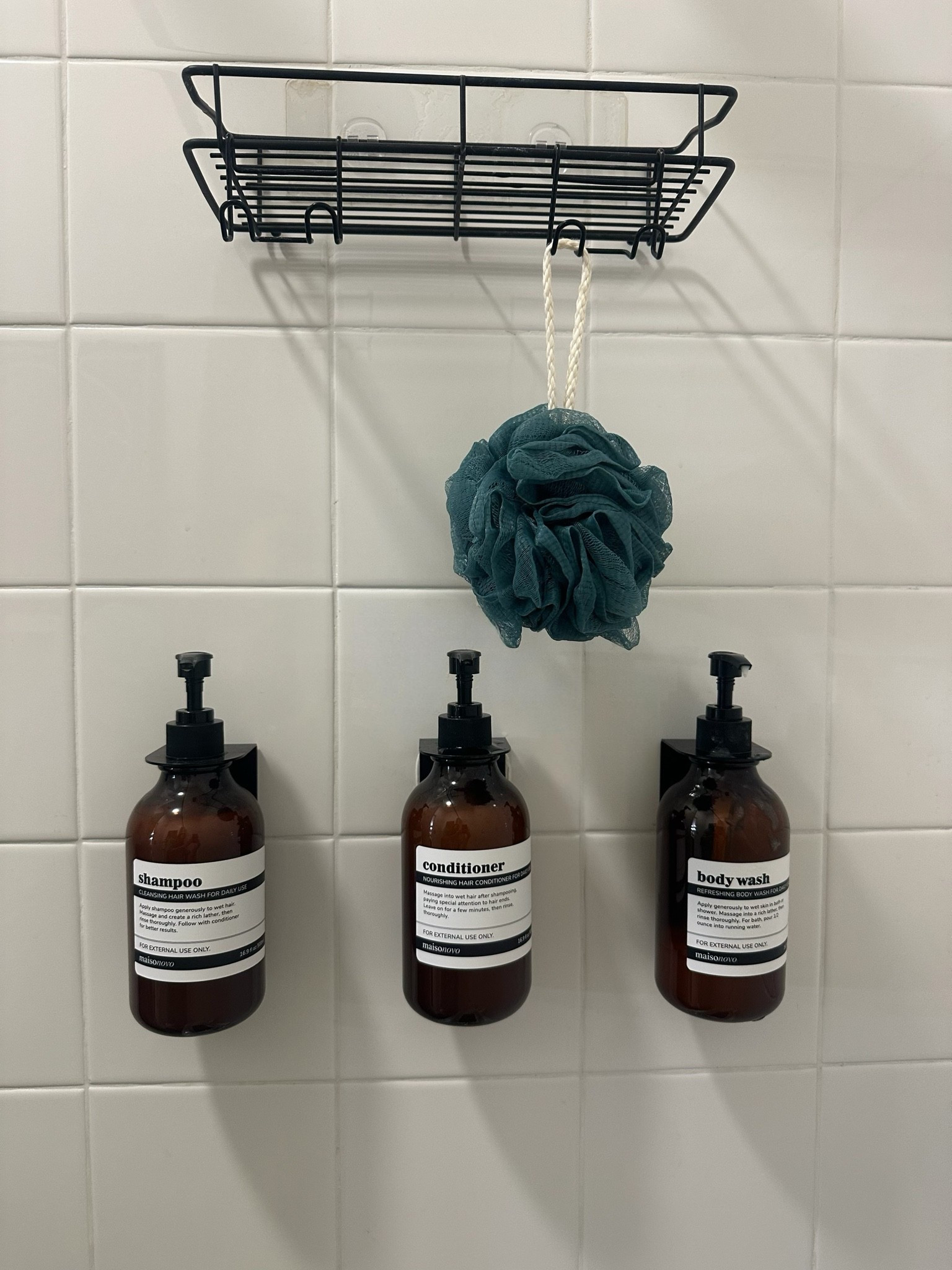 Plastic amber shampoo, conditioner & body wash bottles that hang in shower