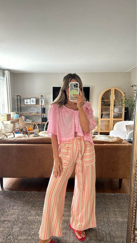 Favorite top and striped pants combo. Top is a size small and fits true to size for free people. Pants are a size small and run longer. So comfy and perfect beach pants 