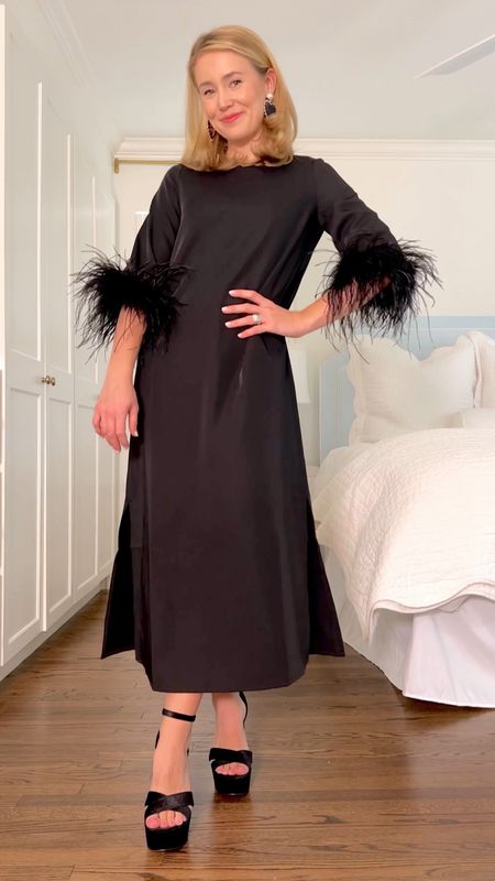 This black feather dress is perfect for winter weddings and holiday parties! 

SIZING:

Dress // The fit is loose. I sized down one size to an XXS like I always do in the Tuckernuck line.

Shoes // Order your usual size.

Earrings // Old from baublebar. Similar linked!