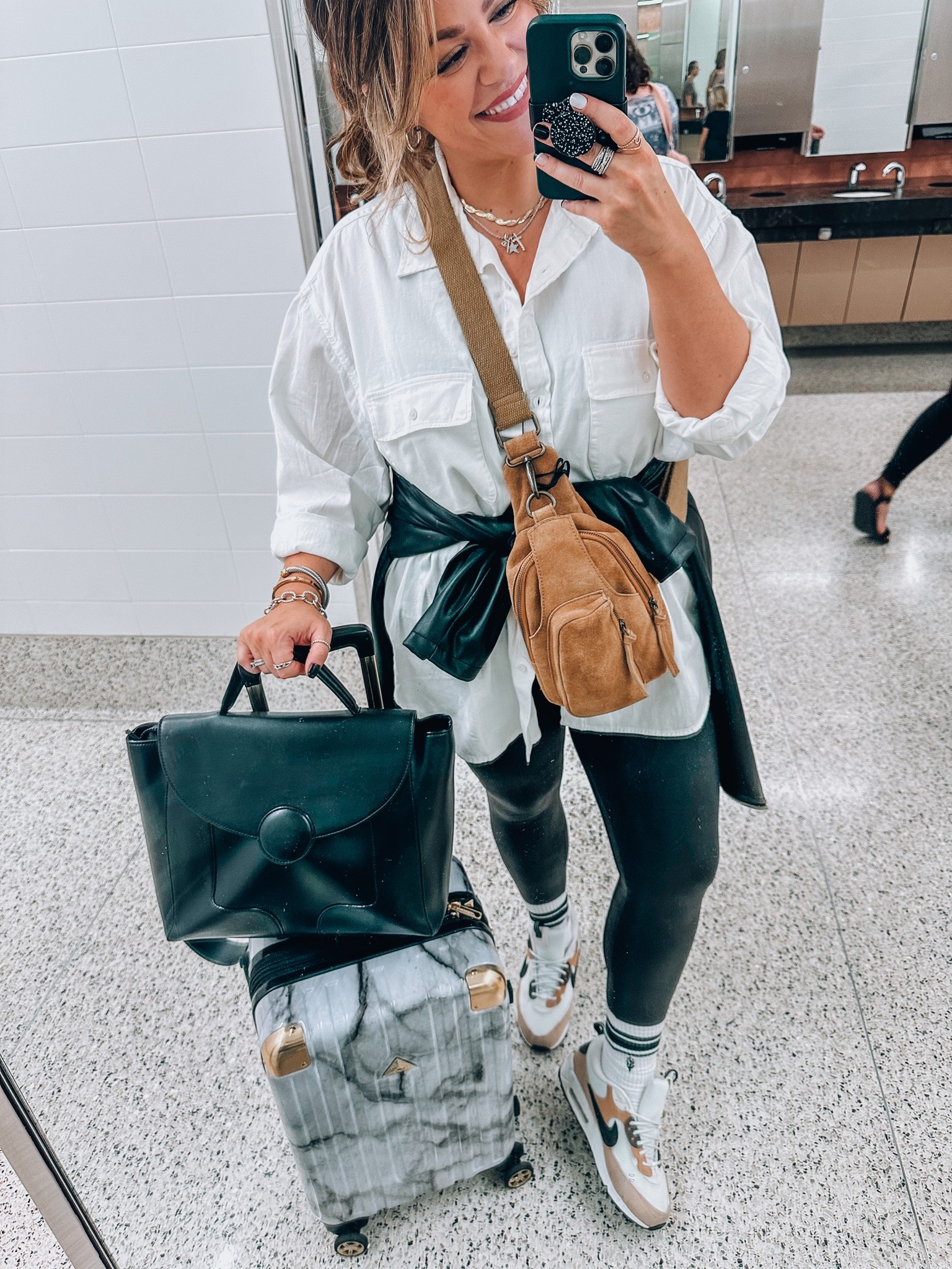 Size 14 travel outfit 
Sling bag (curve friendly), convertible backpack laptop bag, suitcase
Oversized thick white button down blouse large, faux leather jacket xl
Tank large, faux leather spanx leggings (size up wearing a 1xl- get a petite if you are under 5’6” tall) varsity socks, Nike air max sneakers tts 

#LTKitbag #LTKtravel #LTKcurves