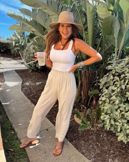 In a small square neck tank bodysuit, medium linen wide leg pants, necklaces, hat, sandals and accessories for spring - all fits TTS.

#LTKSeasonal #LTKstyletip #LTKfindsunder50
