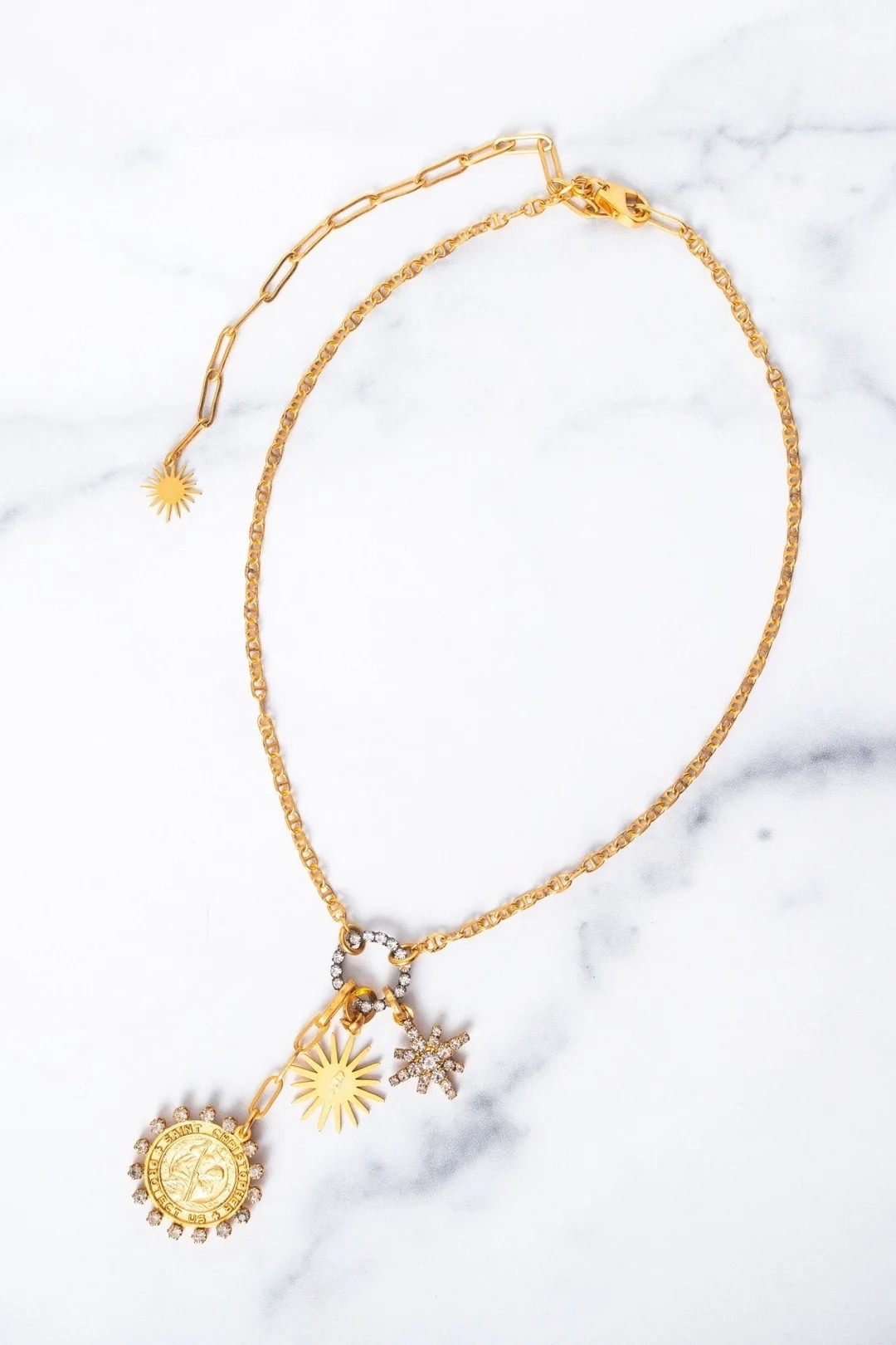 Elizabeth Cole 
Roxanne Necklace

It's no surprise Roxanne is a bet seller. A meaningful mix of St. Christopher and celestial charms brings a sense of protection, light and personal story to a piece you'll reach for every day

#LTKootd #LTKTravel #LTKWorkwear