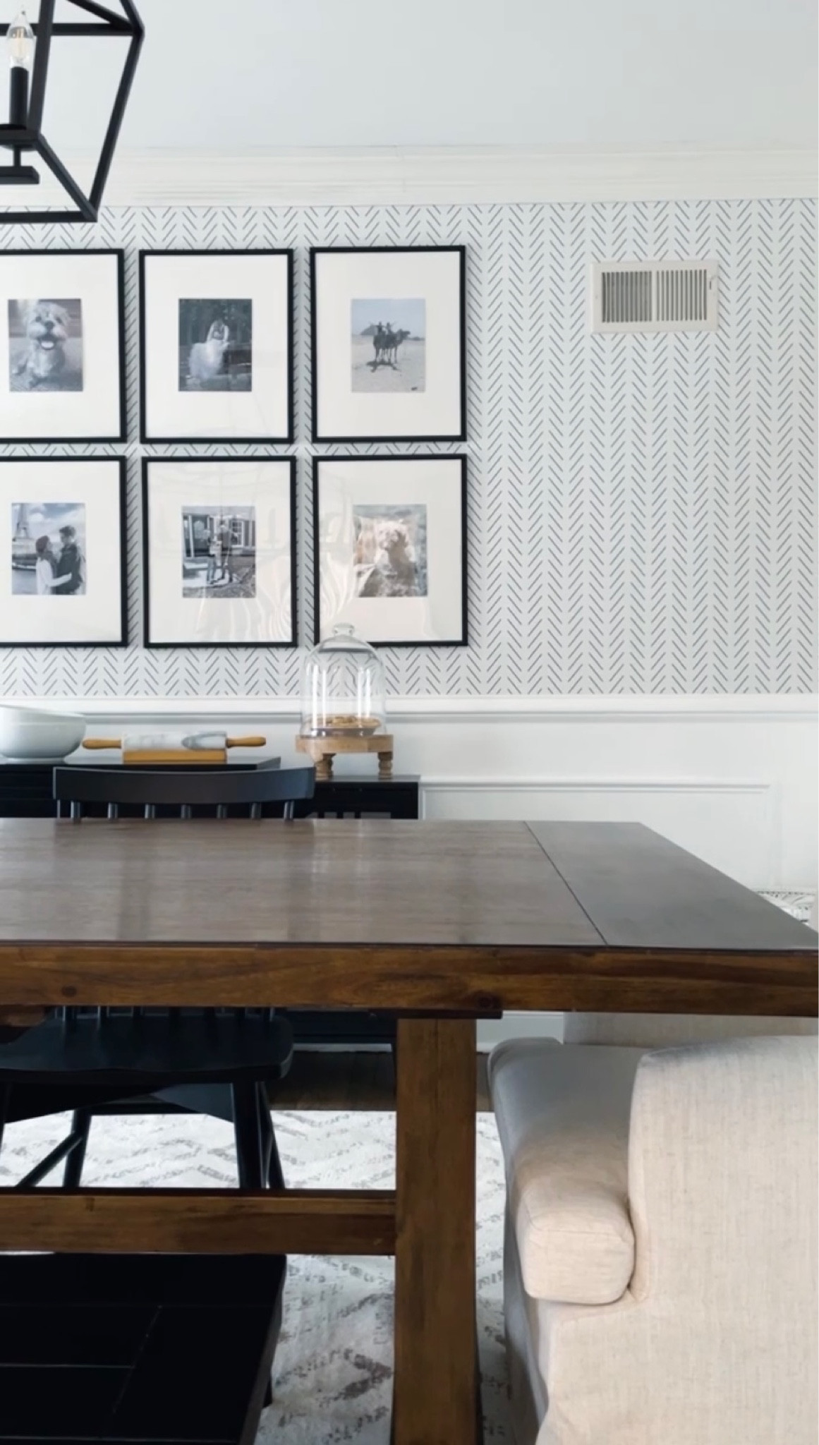 Dining room with black buffet cabinet, farmhouse table and chairs, gallery wall, and herringbone peel stick wallpaper 🤍

#LTKhome
