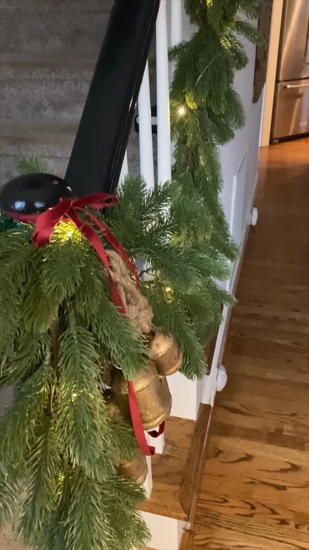 Hang my garland on my staircase banister with me! I can’t decide if I like it better during the day or at night. It adds all the Christmas magic without breaking the bank! I finished off the look with these gorgeous holiday bells and burgundy velvet ribbon.

#LTKSeasonal #LTKhome #LTKHoliday