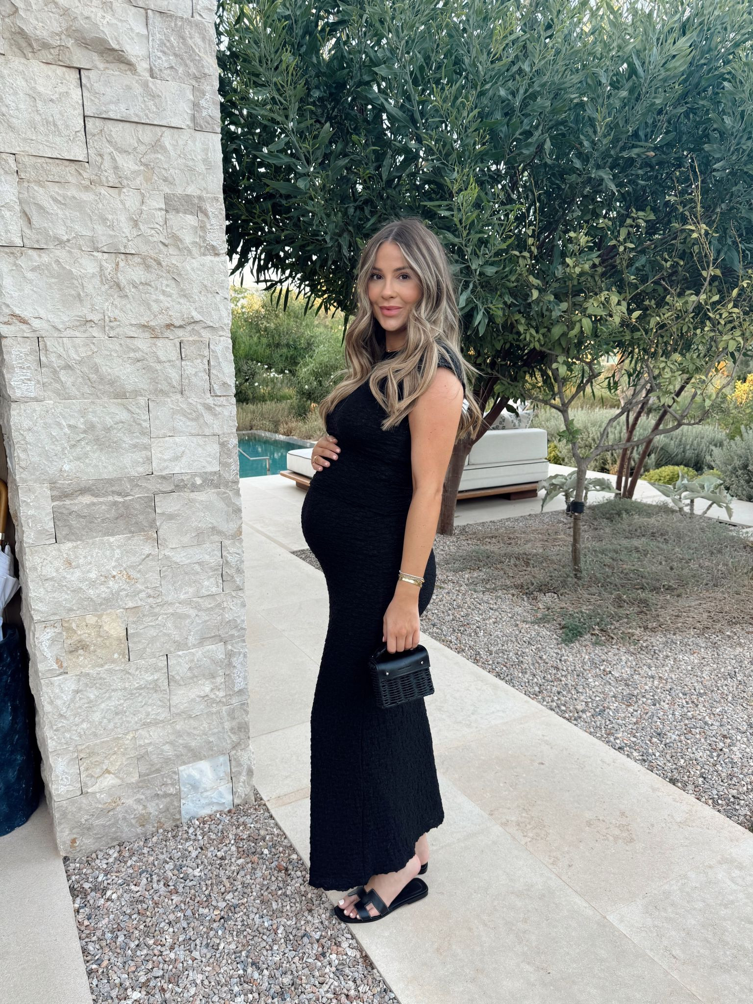 Summer holiday evening maternity outfit - black new look crinkle midi skirt & top, mini black basket bag, Hermes Oran black sandals

#LTKuk #LTKsummer #LTKmaternity