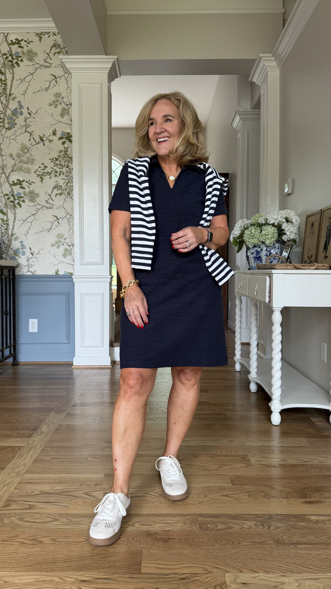 A navy and white outfit just feels right for Memorial Day weekend 🇺🇸 This sporty chic look combines a classic navy dress, striped sweater, and comfy white sneakers for an effortless outfit that’s polished, comfortable, and perfect for backyard gatherings, travel days, casual dinners, or holiday weekend plans. 

 #LTKootd #LTKSeasonal #LTKOver40