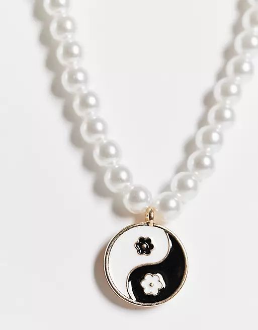 ASOS DESIGN necklace with pearl and flower ying yang charm | ASOS (Global)