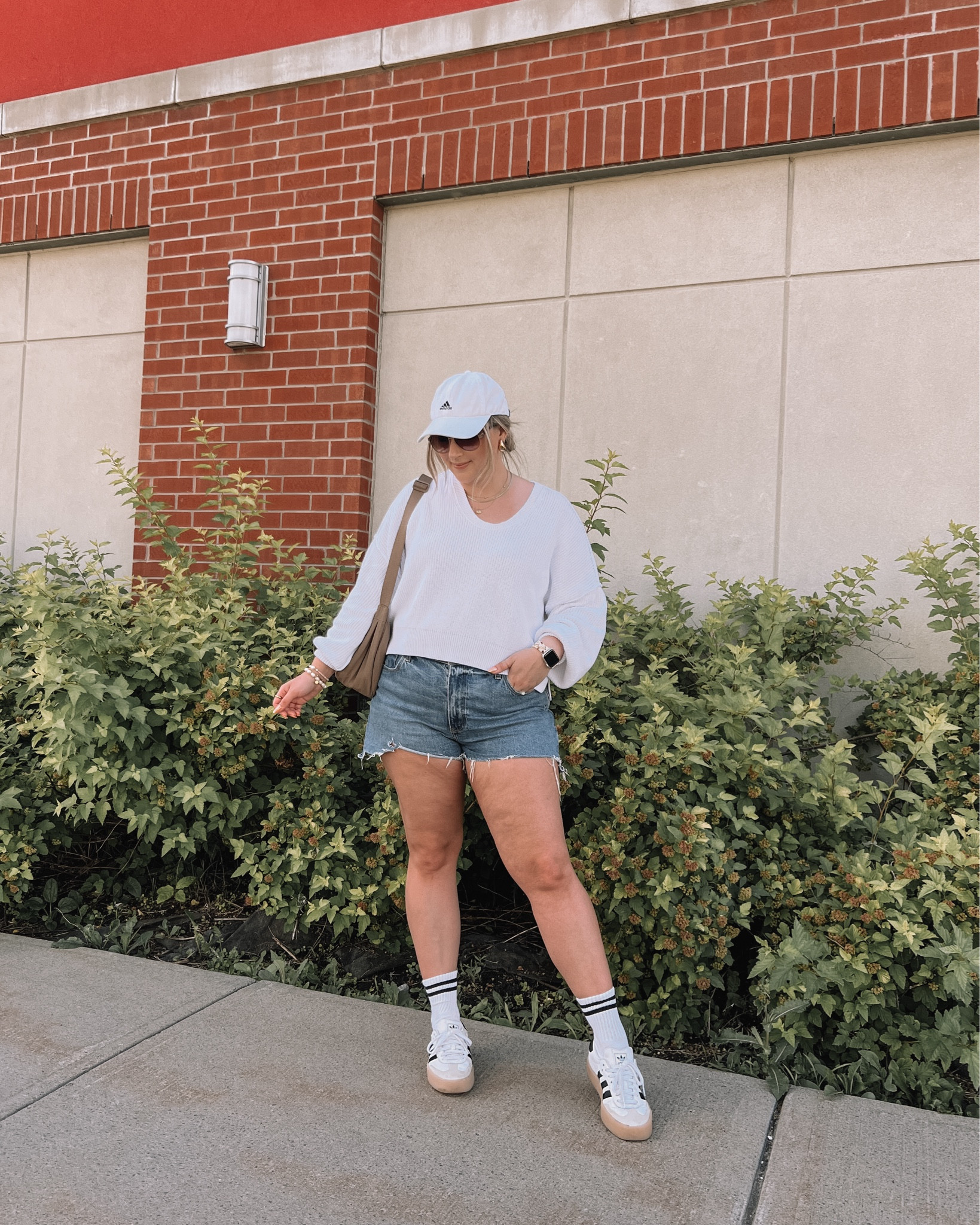 Comfy casual midsize summer outfit - cropped white sweater (M), Abercrombie denim shorts (sized up 1 to 33), adidas sambas (sized down 1/2), baseball cap 
 

#LTKsummer #LTKcanada #LTKmidsize