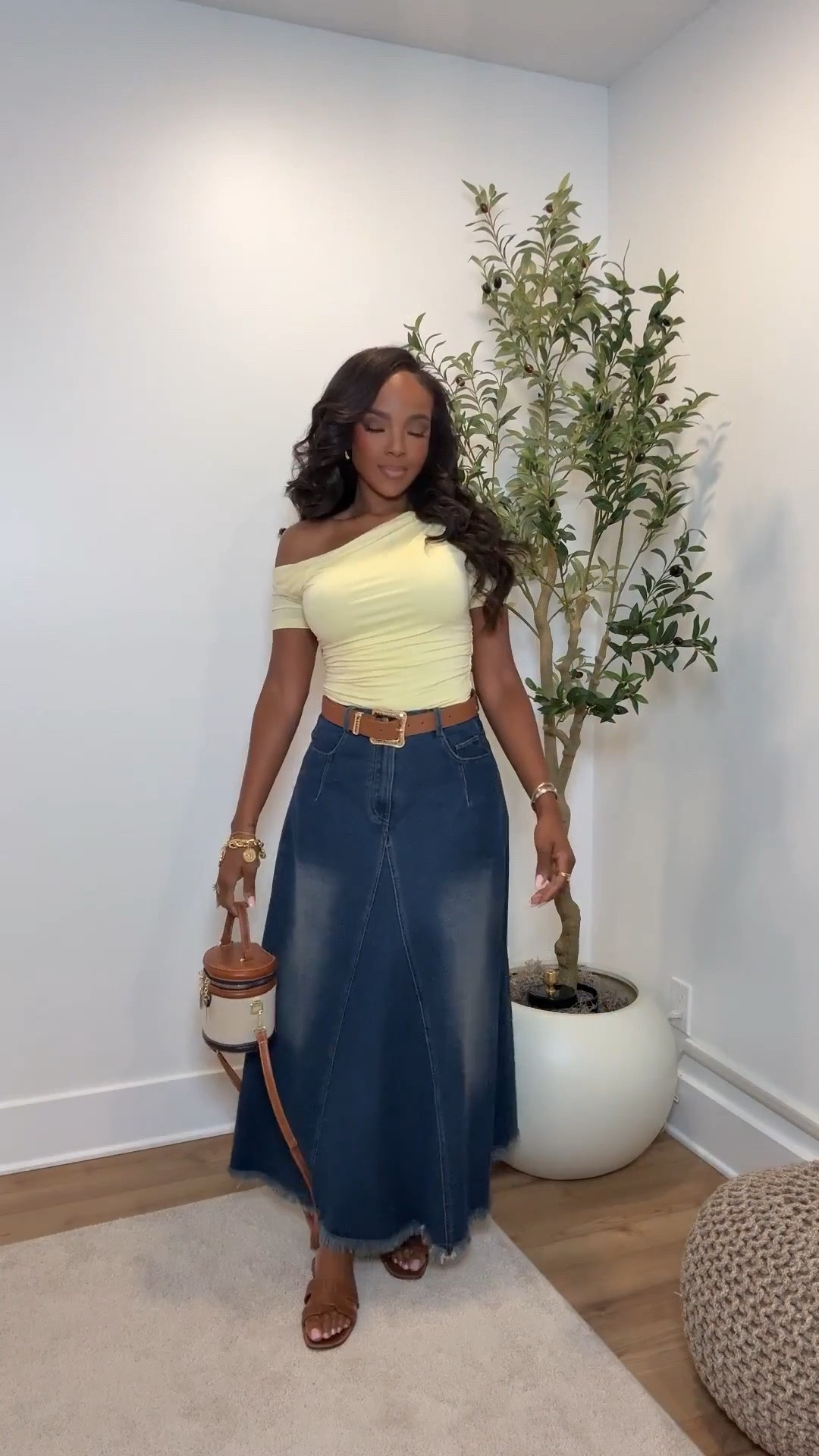 Hi Babes! 

This denim maxi skirt look is giving effortless cool-girl energy 💛 The soft yellow off-shoulder top paired with the structured denim silhouette feels so feminine and easy at the same time. I love how the belt and neutral accessories pull the whole outfit together without overcomplicating it.

The skirt has such a flattering shape through the waist and hips while still giving movement, and the top is super soft and comfortable for all-day wear.

Perfect for:
• Casual brunch or coffee dates  
• Weekend shopping days  
• Summer travel outfits  
• Everyday elevated casual looks  

Undergarments: seamless nude bra + nude thong for the smoothest fit under the skirt.

Everything is linked below ✨

xx Kira | IG: KirasFashionFinds

34D - 27 - 40 • Size Small or 4