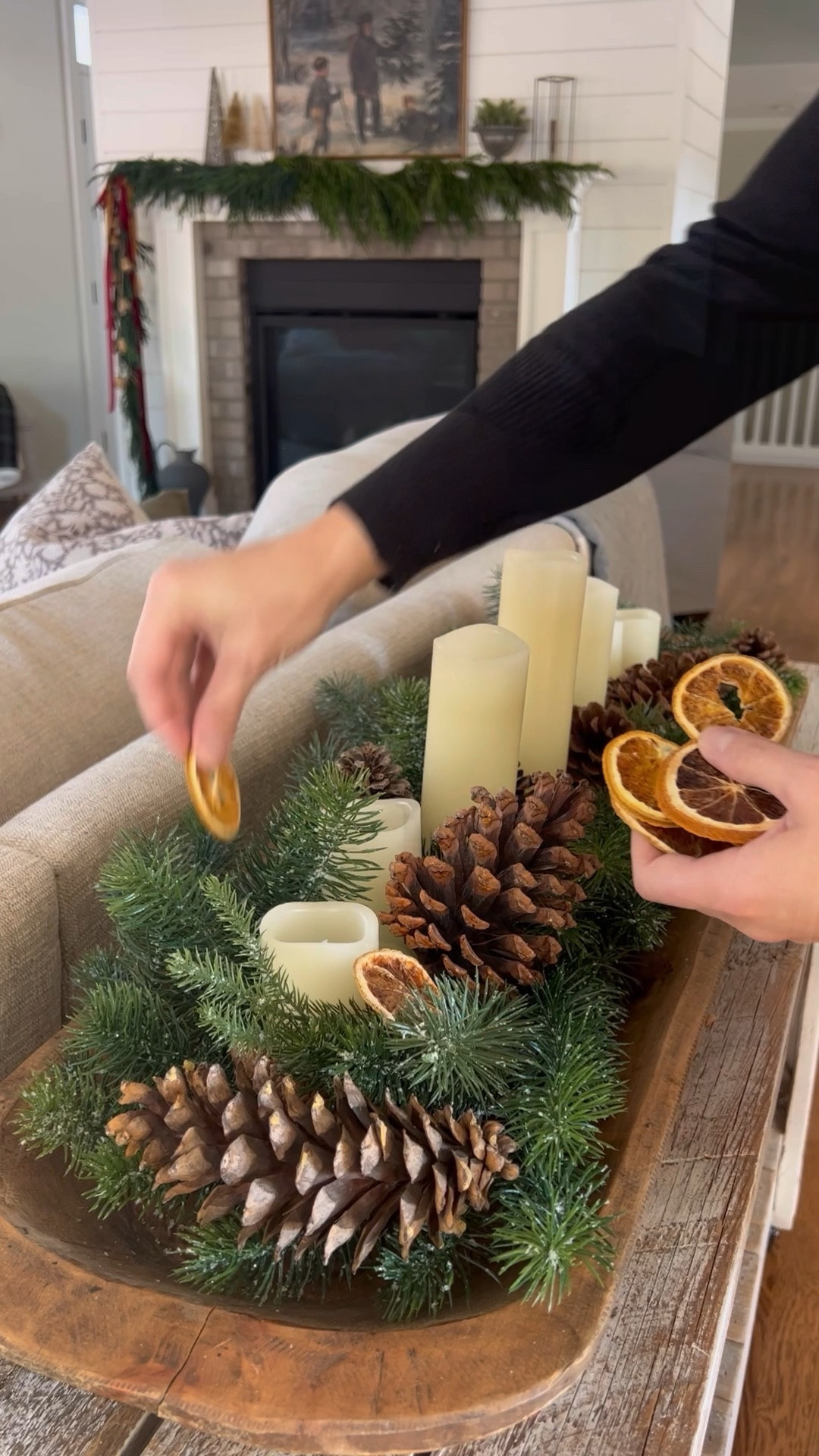 This dough bowl centerpiece is the most viral of all my videos. At nearly 22 million views on one platform alone it definitely made an impact. so I’m bringing it back around to inspire once again. 

It’s so simple to re-create using my long, shallow dough bowl, a flexible pine garland, flameless candles, pinecones, and dried oranges. 

#LTKVideo #LTKHoliday #LTKHome