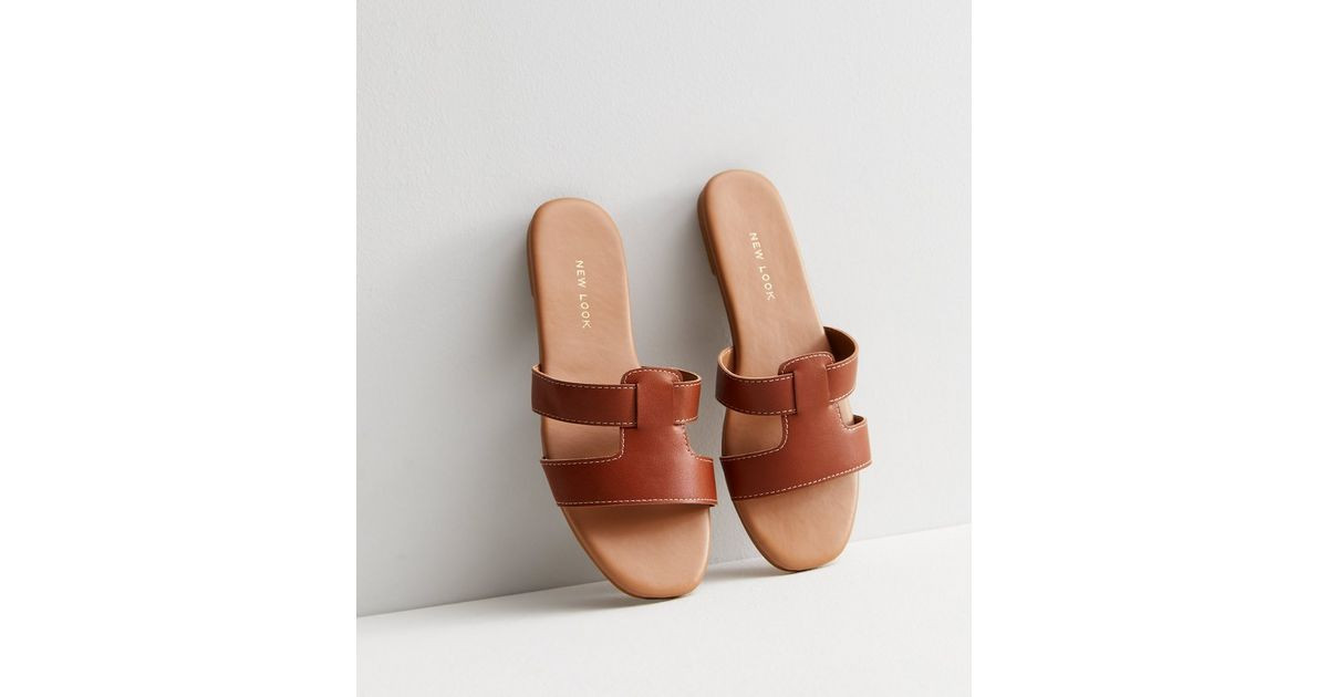 Tan Leather-Look Sliders
						
						Add to Saved Items
						Remove from Saved Items | New Look (UK)