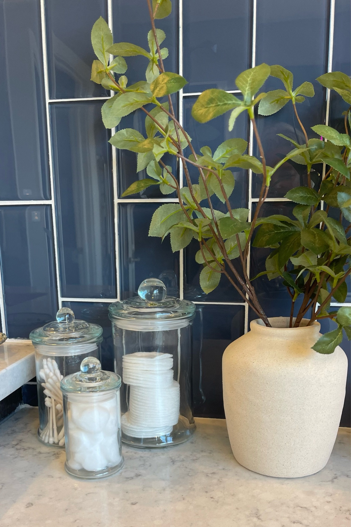 Bathroom counter-love this look.  Glass jars from Amazon and faux plant from Target.  

#LTKhome #LTKfindsunder50 #LTKfindsunder100