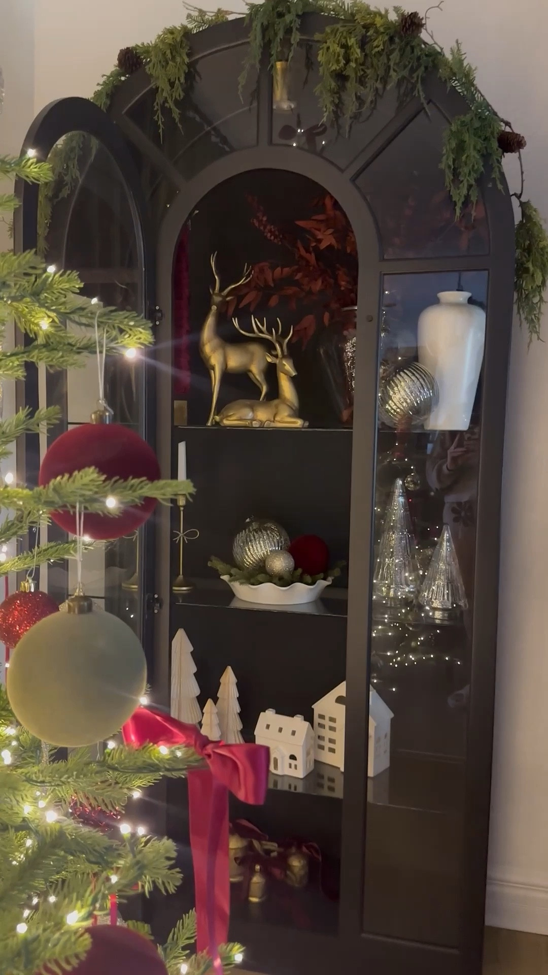 Vintage Arched cabinet styling for Christmas 
Walmart home decor
Pottery barn 
Vintage Christmas 
Ornaments 
Silver and gold 
Reindeer 
Ralph Lauren Christmas 
Pottery barn 
Walmart 
Designer look for less 
Glass cabinet 
Cozy home 
Christmas tree 
Style with me 
Walmart arched cabinet
Vintage decor 
Walmart home 
Vase 
Artwork 
Cabinet 
Dining room 
Credenza 
Moody 
French country #LTKStyleTip

#LTKHoliday #LTKSaleAlert #LTKHome