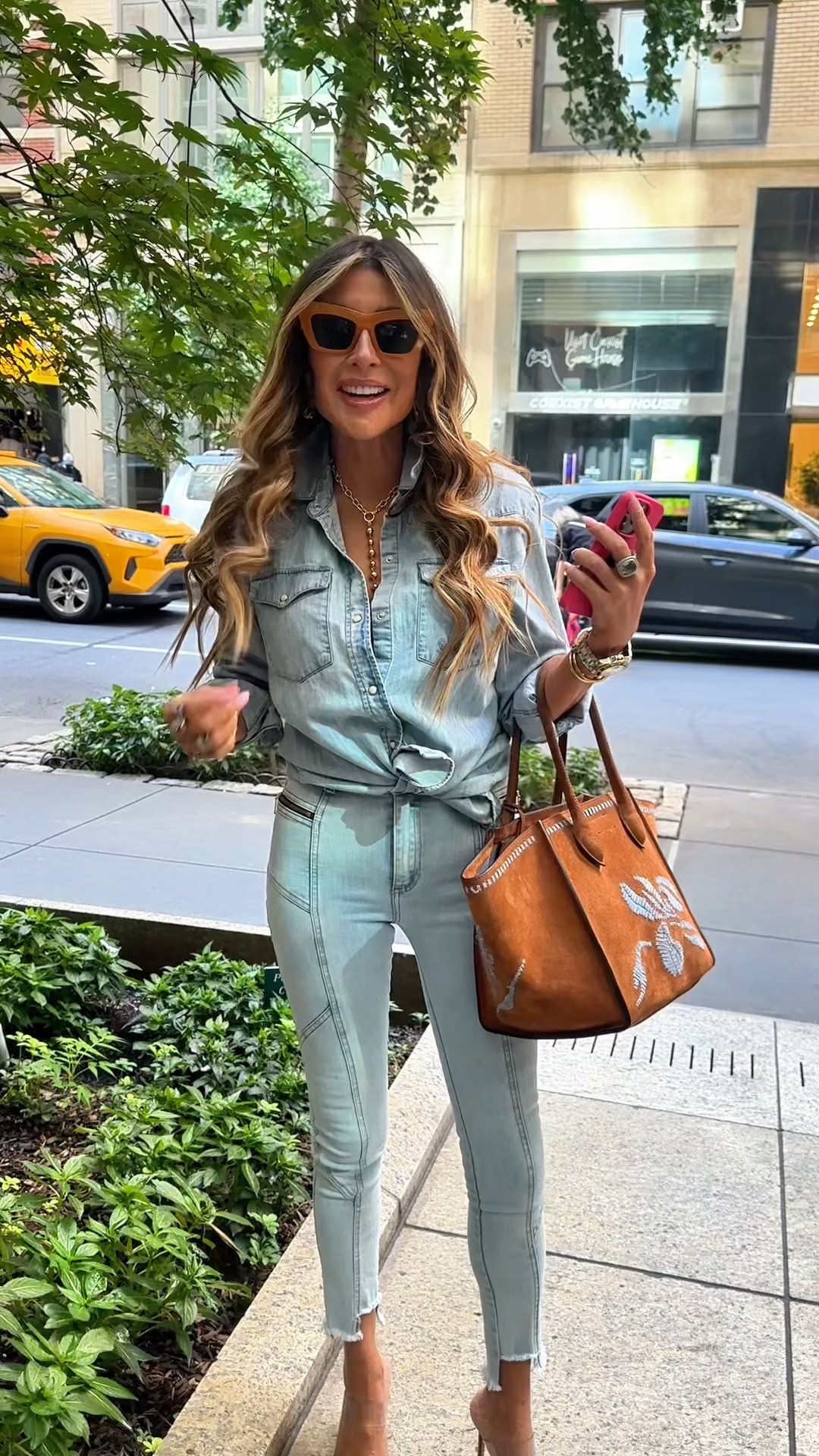 Shop the look! I’ve linked to her favorite hair product, as well as the bracelets. I’ve also linked to the bag brand, although this exact bag is sold out. Also linked to a similar denim top and pants so you can create the look.

#LTKBeauty