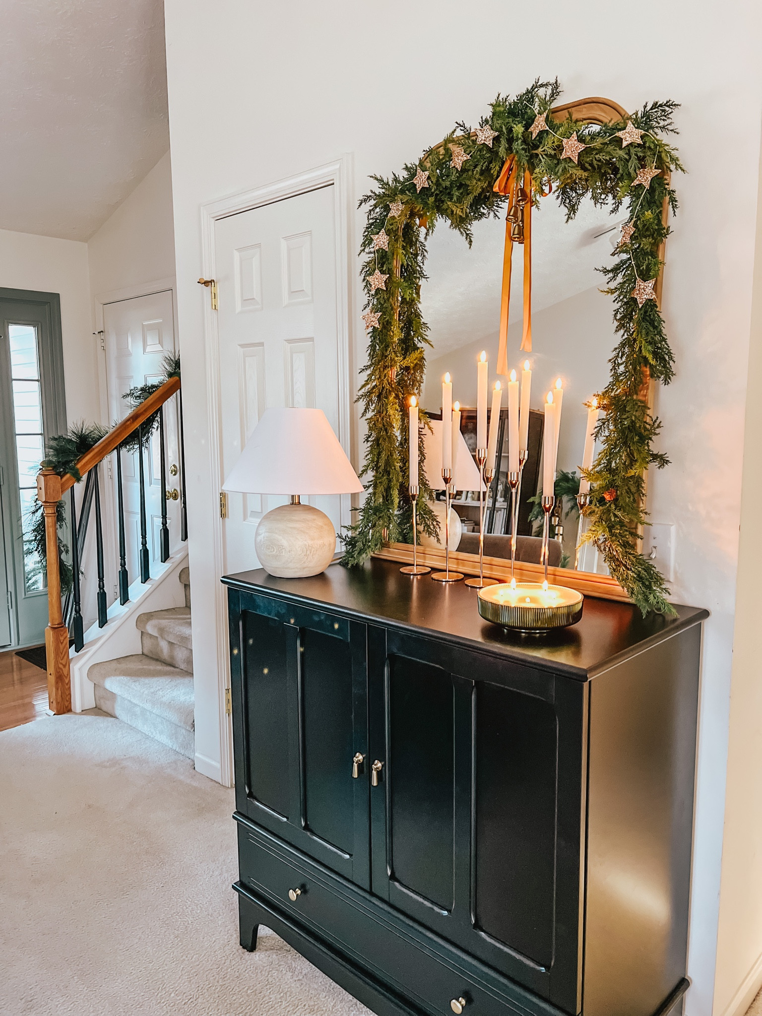Christmas cabinet/console styling

Holiday decor | entry way | garland | greenery | candle | neutral style | black | wood mirror 

#LTKSeasonal #LTKhome #LTKHoliday