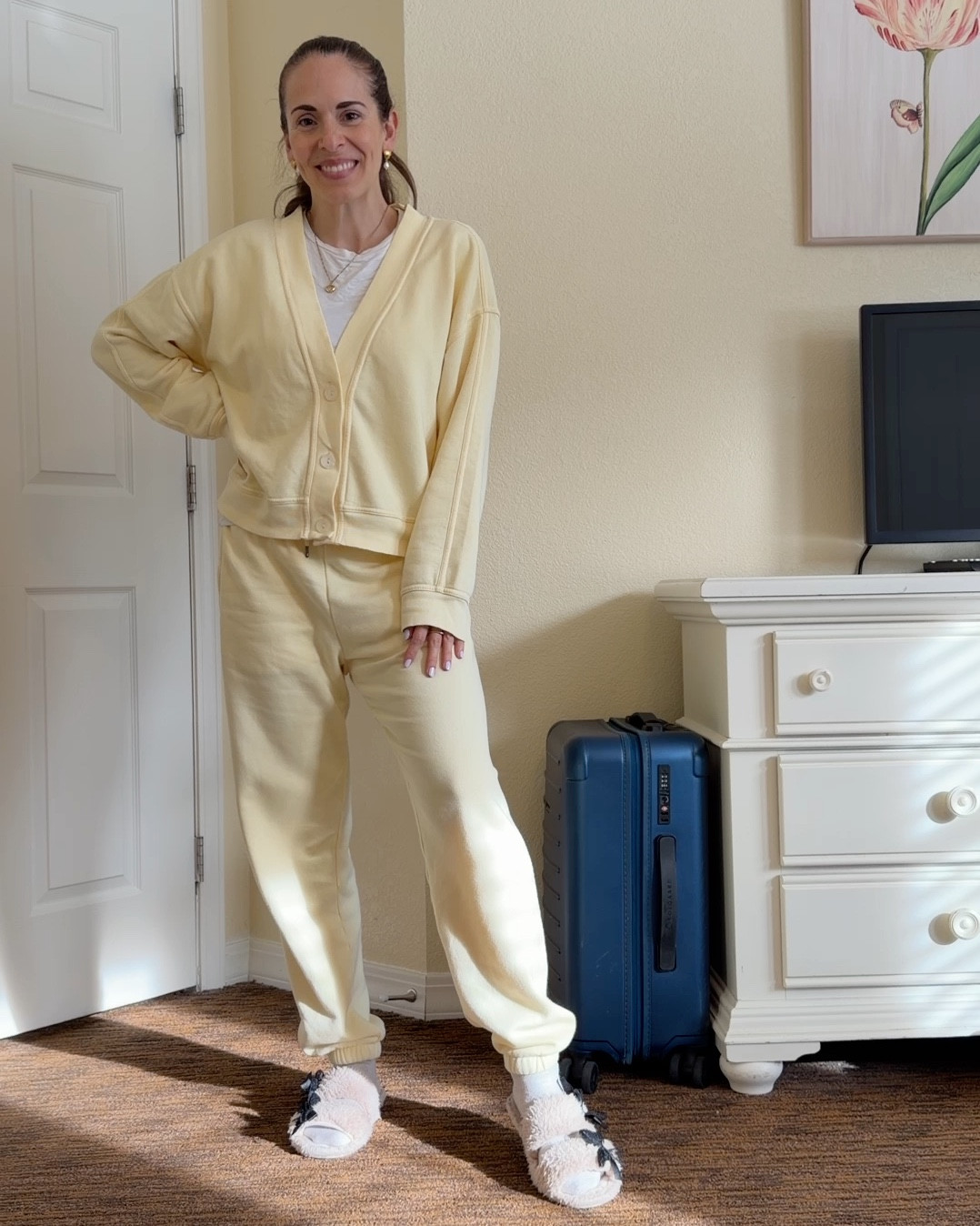 Loving this butter yellow cardigan sweatshirt and sweatpants matching set- perfect for travel to our ski trip in the car recently (I took these pics and video in that hotel room) and will definitely get reworn for our flight to the Dominican Republic! So soft and comfy and stylish (and not expensive at all!) 

#LTKSaleAlert #LTKmomlife #LTKTravel