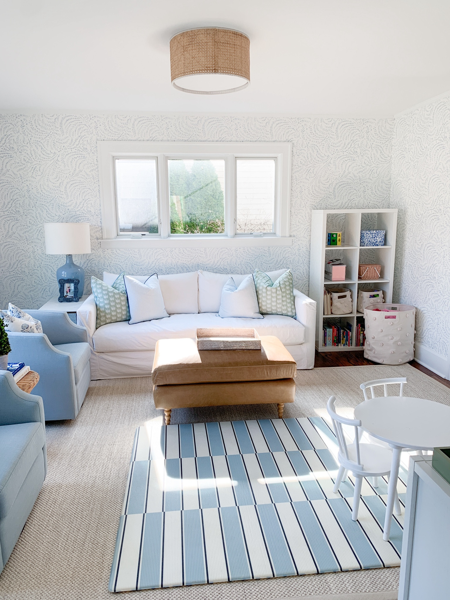 Updated photos of our playroom. Playroom storage, leather ottoman, white couch 

#LTKkids #LTKhome