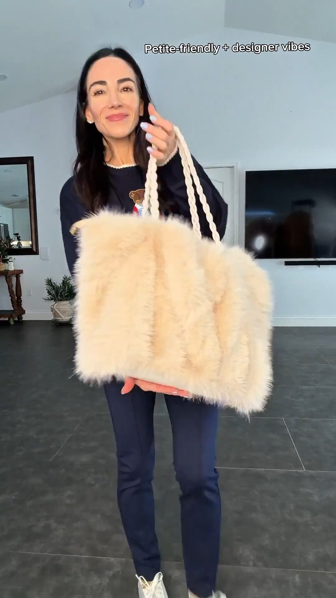 This whole outfit is a look-for-less moment and I’m not mad about it.
The teddy bear sweater is lightweight, thin, and actually petite-friendly — I’m in an XS and it doesn’t overwhelm my 5’0 frame at all. Navy Banana Republic ponte leggings in XXS for that clean, tailored fit, the fuzzy Amazon bag for texture, and the ballet flats that give designer energy without the price tag. Cozy, polished, and very wearable.

#LTKootd #LTKPetite #LTKSeasonal