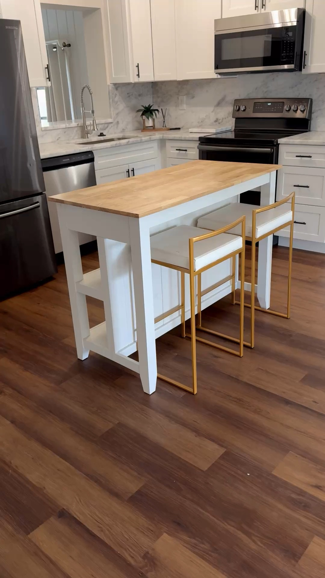 This movable kitchen island is so versatile.  Also works well as a bar 
Home decor 

#LTKdayinmylife #LTKSeasonal #LTKHome