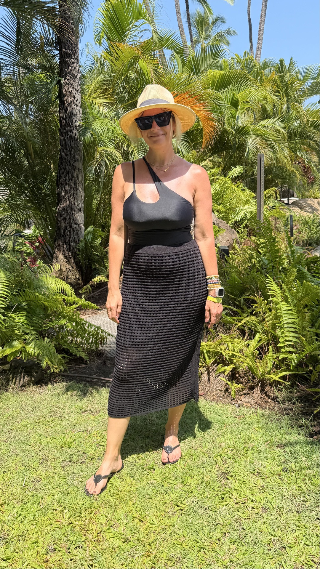 Here are 5 vacation looks I packed for Hawaii🌺

A Hawaii capsule doesn't need to be complicated. Here's how I packed for a full week with pieces I already owned — swim, casual, and dinner all covered.

Look 1: Beach to Resort Black one-shoulder swimsuit + crochet midi coverup skirt + panama hat + flip flops. One swimsuit, one coverup, and suddenly you're resort-ready. The coverup does double duty from pool to lunch without missing a beat.

Look 2: Pool to Lunch Red swimsuit + bold tropical print wrap skirt coverup + flip flops. A wrap skirt coverup in a bold print is the easiest way to go from pool to lunch without changing. The red swimsuit peeking out as the "top" ties the whole color story together perfectly.

Look 3: Beach Day Blue and white stripe bikini top + denim cutoff shorts + panama hat + sandals. A great bikini top worn as a crop top with denim shorts is the vacation outfit formula that never fails.

Look 4: Casual Day Black crop tank + black shorts + sandals. The easiest outfit in the bag. When it's hot and you just need to move, a matching set in black works every single time. 

Look 5: Dinner Ready Chocolate brown tank + brown and cream floral maxi skirt + shell necklace + flip flops. A printed maxi skirt is the single hardest working vacation piece you can pack — dressy enough for dinner, relaxed enough for a sunset walk.

Linked everything and/or the closest versions I could find so you can shop the whole capsule. Everything shoppable below! 👇

#LTKootd #LTKOver40 #LTKTravel