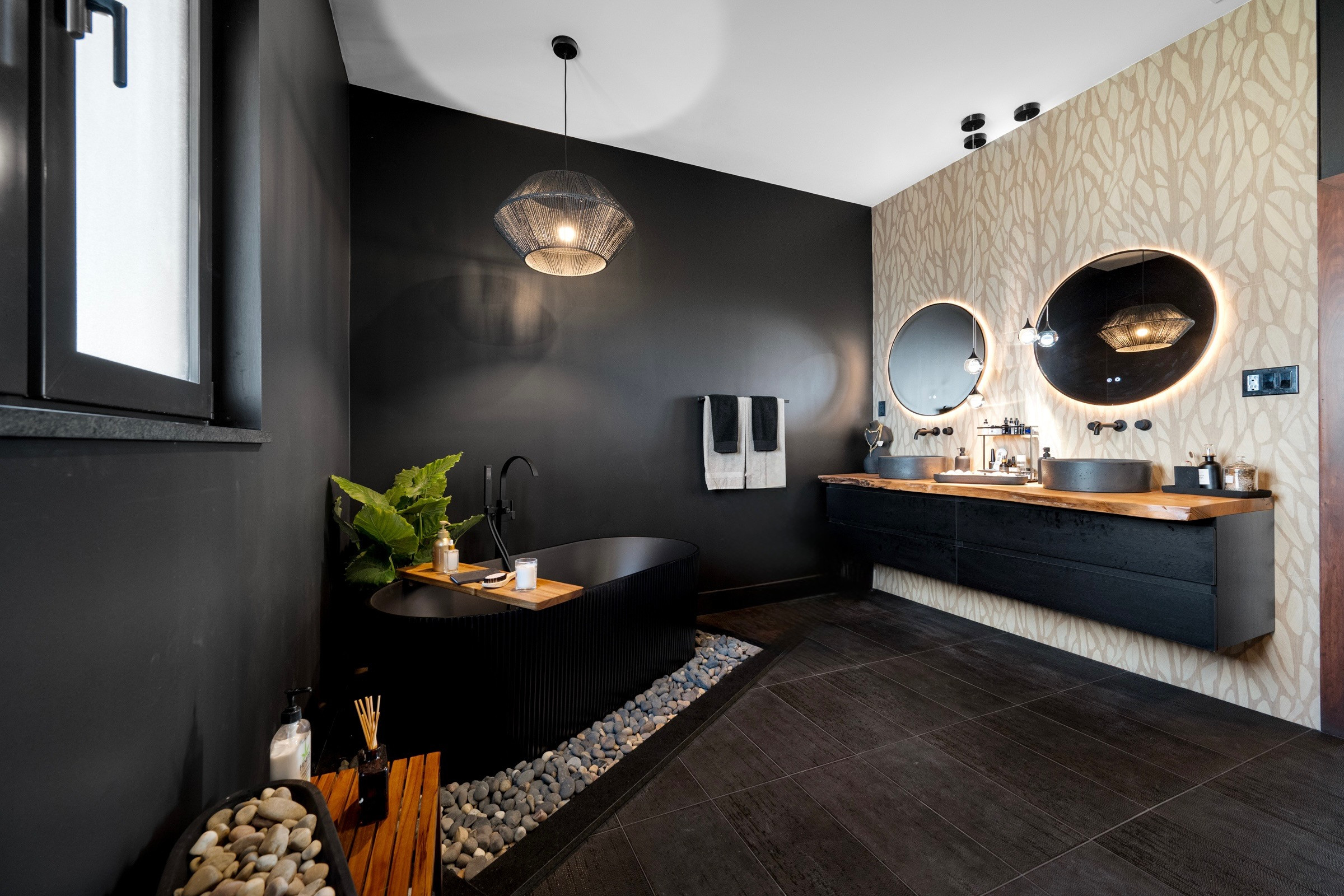 Serenity, redefined. 🖤✨

This spa-inspired bathroom blends deep black tones with rich dark wood textures to create a space that feels both grounding and luxurious. Clean lines, natural materials, and soft lighting come together for the ultimate retreat—right at home.

Designed for calm. Styled for impact.

#SpaBathroom #InteriorDesign #ModernLuxury #BathroomInspo #DarkInteriors #DesignByRania #CoastalModern #LuxuryLiving 

 #LTKHome