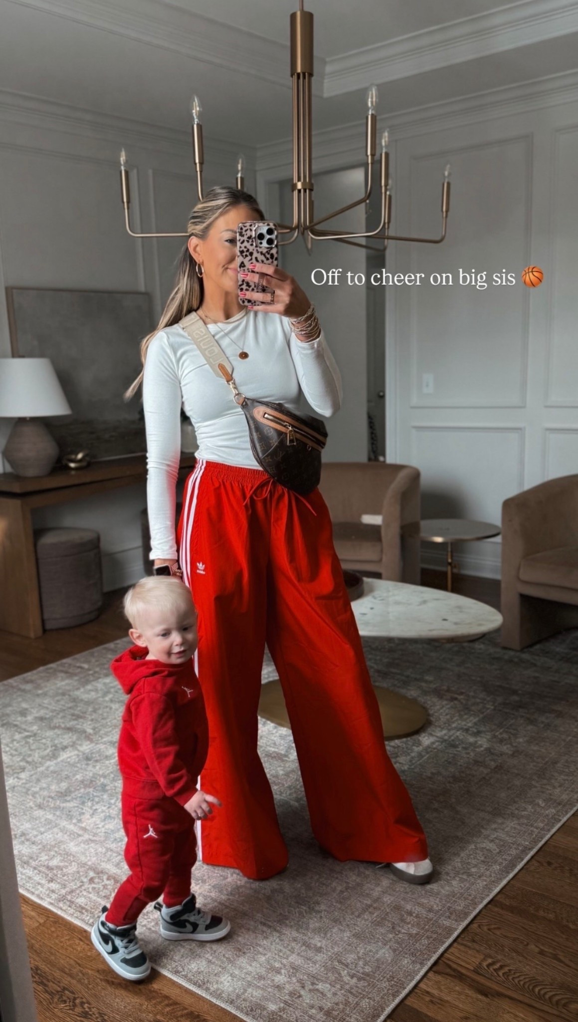 Off to cheer on big sis 🏀 Saturday sport’s mom outfit of the day! My pants are so fun! Definitely oversized I have a small regular. Reid’s little toddler Nike set is the cutest! 

#LTKKids #LTKdayinmylife #LTKootd