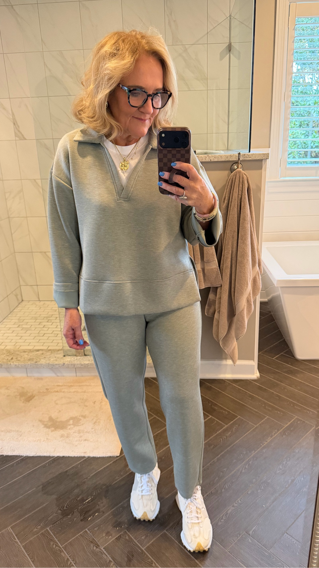 Spanx air essentials I love this new color. I’m wearing a medium in the polo top and a medium petite in the slim straight bottoms. It also comes in the wide black and a new fabric. That’s a ribbed air essentials.  
Allie & Bess 20% off code NANETTE20

Spring loungewear, travel outfit spring cozy 

#LTKTravel #LTKOver40