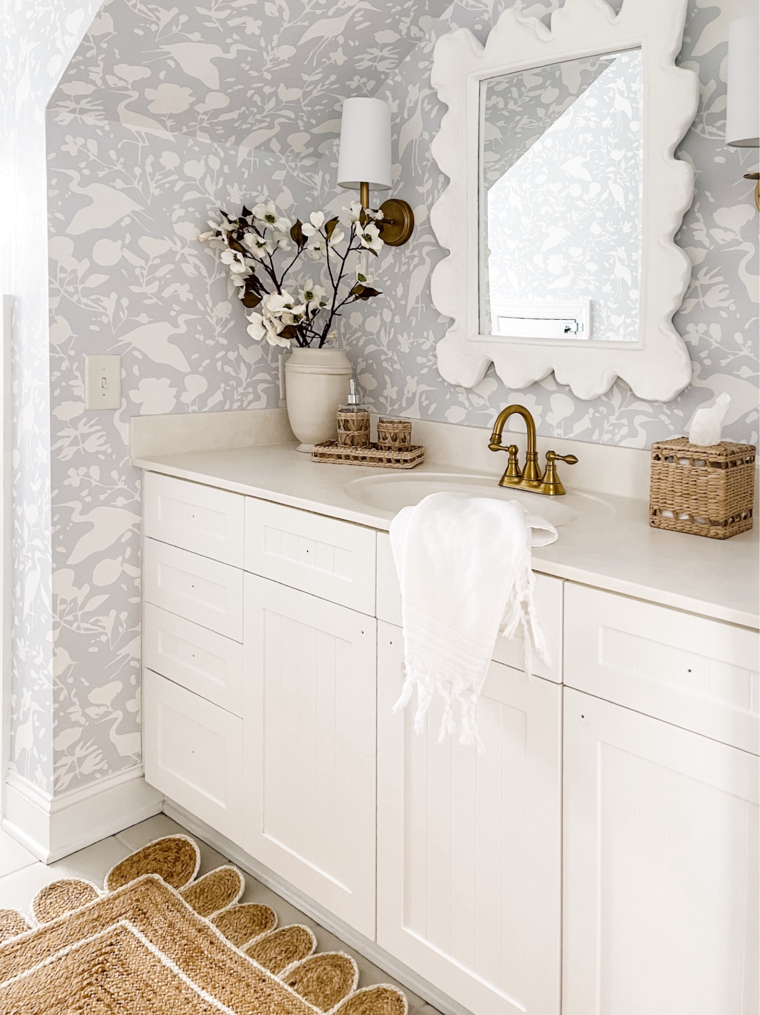 Kid’s bathroom with blue wallpaper and Amazon lighting. Designer look for less!

Bathroom hardware brass floral scalloped coral girls kids room