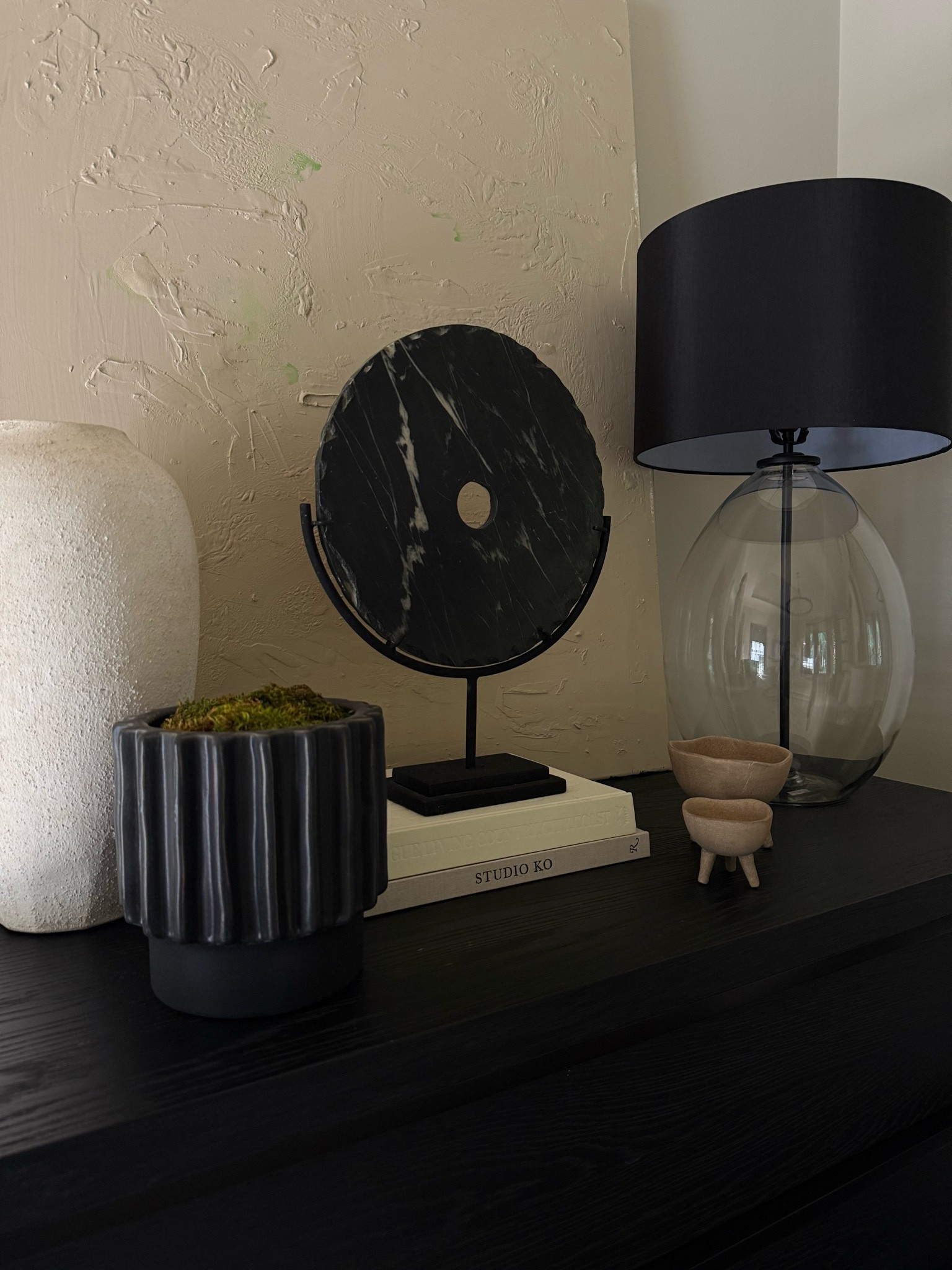 Obsessed with this corner in our bedroom! I love the way the glass lamp adds contrast to the heaviness of the black marble disk (a very affordable find!) and the rough texture of the vase (currently on sale!) XxV

#LTKSeasonal #LTKSaleAlert #LTKHome