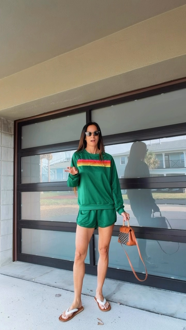 This green retro set is giving sporty, sassy, and just a little bit country club trouble. 💚 The rainbow racing stripes, the perfectly slouchy sweatshirt, and those tiny little shorts? Honestly, she’s cute enough to make me pretend I enjoy cardio. 😂

#MatchingSet #SportyStyle #CasualChic #Over40Style #NicoleColee

#LTKootd #LTKdayinmylife #LTKgrwm