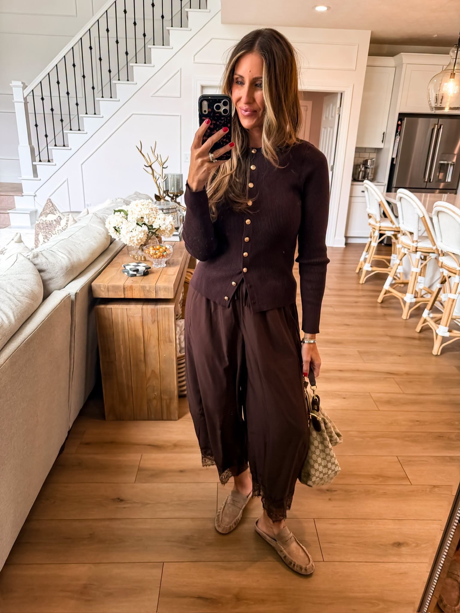 This rich chocolate brown outfit is such a beautiful way to transition into fall. The ribbed button cardigan and flowy wide leg pants create an easy monochromatic look, finished with neutral loafers and a classic handbag.

chocolate brown outfit, fall outfit, monochromatic outfit, brown cardigan, wide leg pants, fall fashion, neutral outfit, themominstyle 

 #LTKootd #LTKSeasonal #LTKOver40