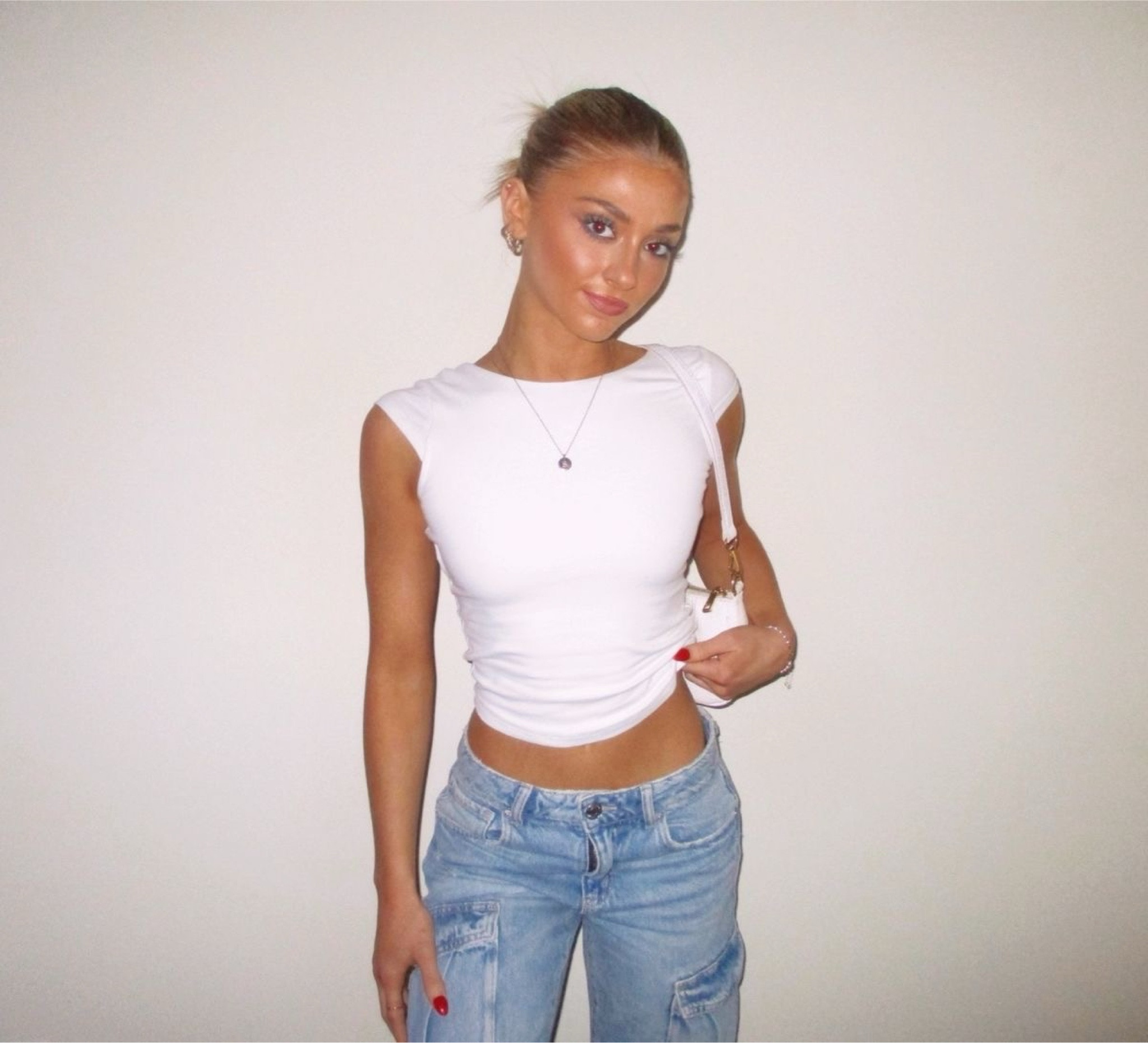 One of my fav casual (but not too casual) going out outfits from garage. Simple open-back white tee, and to elevate the look, wide cargo jeans🤍✨

#LTKSeasonal #LTKstyletip